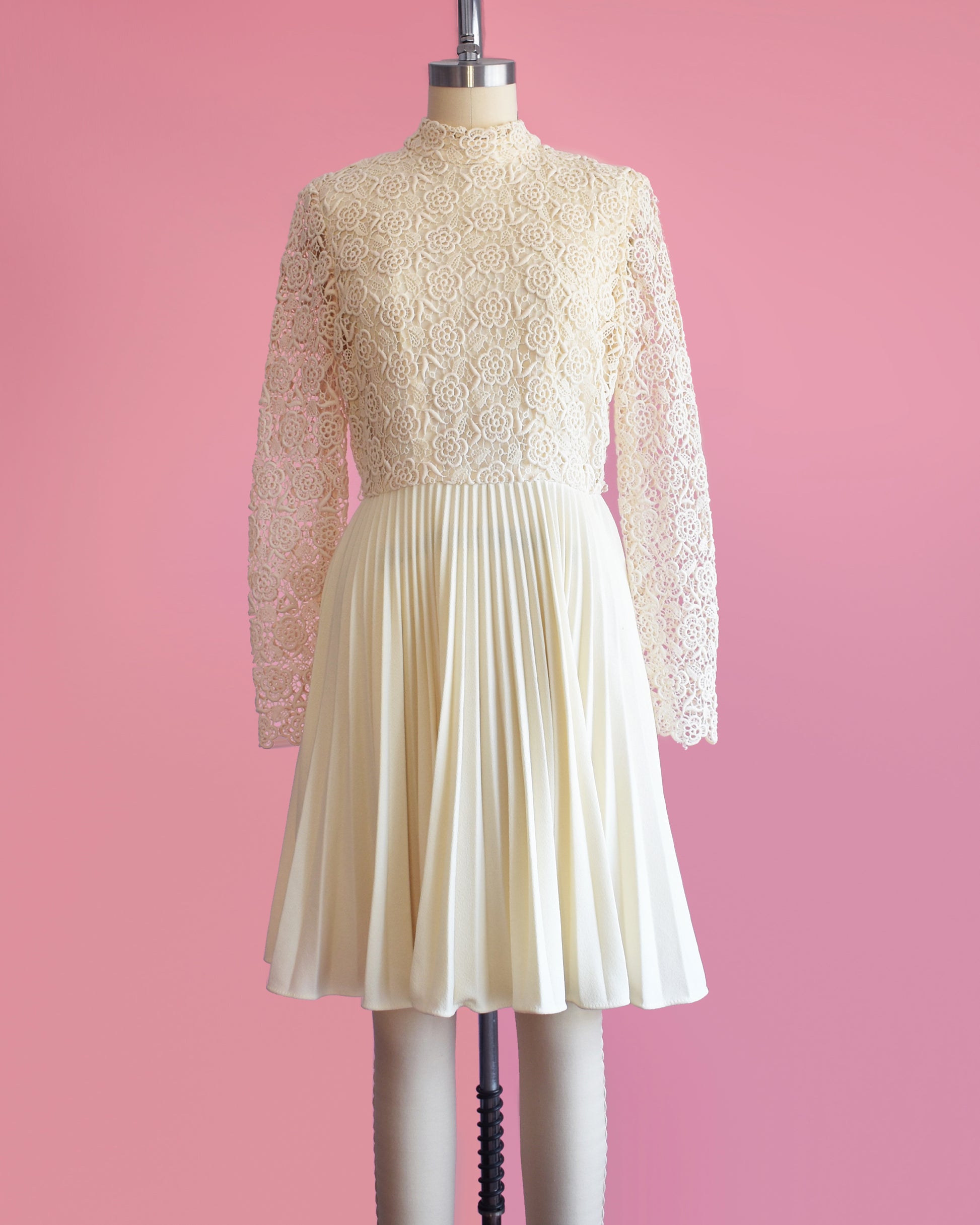 a vintage 1970s crochet floral lace pleated dress