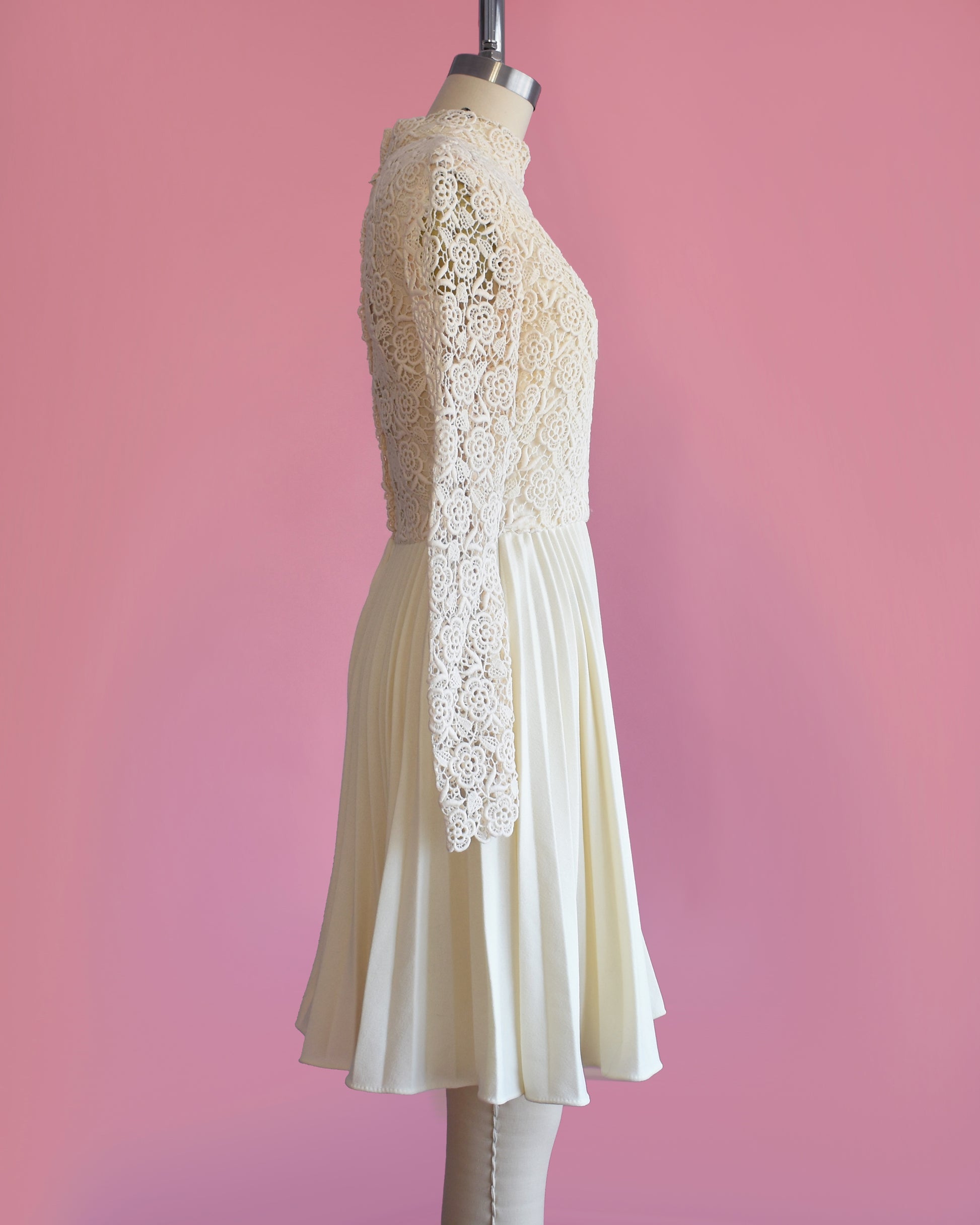 side view of a vintage 1970s crochet floral lace pleated dress