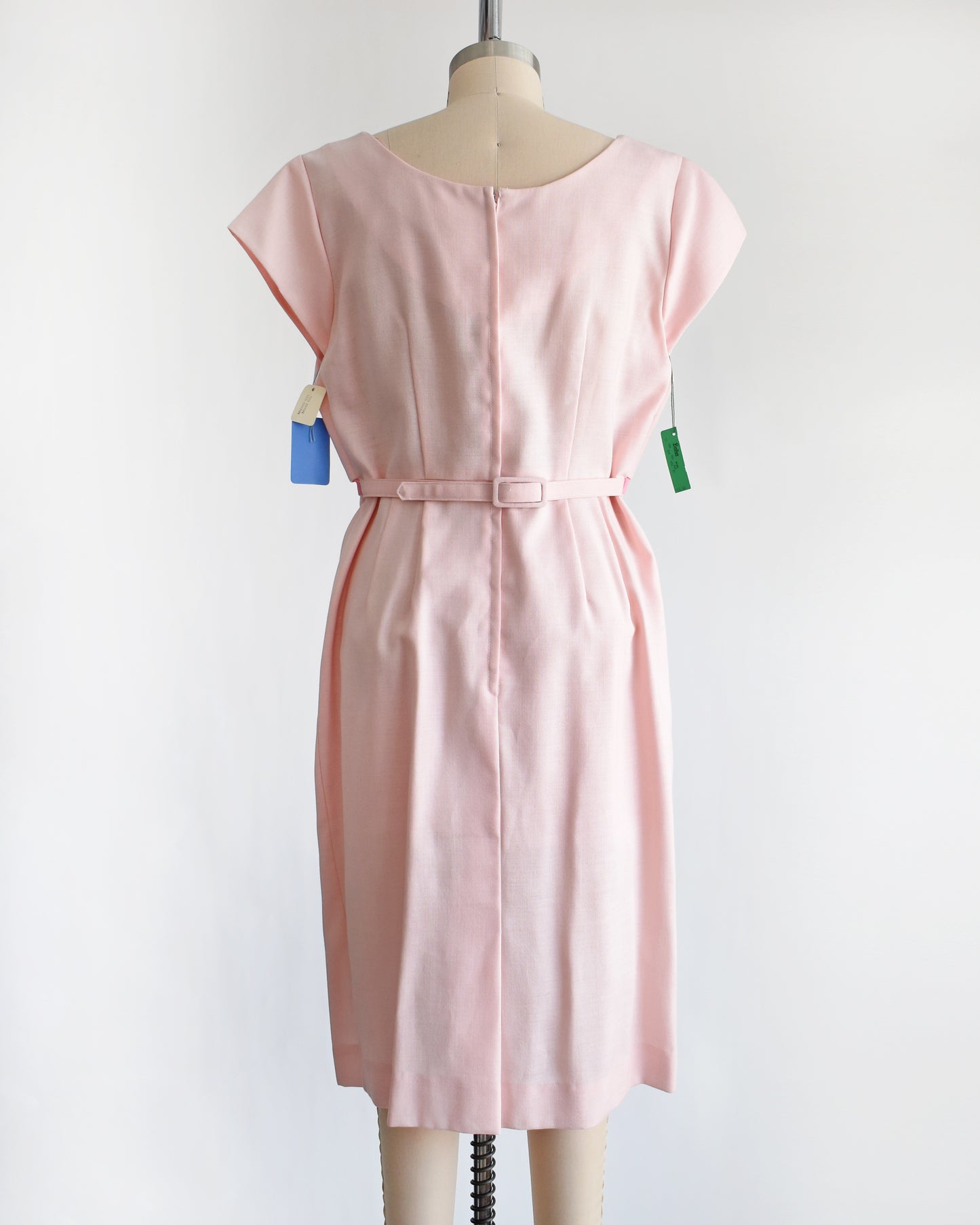 back view of a vintage 1960s pink floral embroidered dress