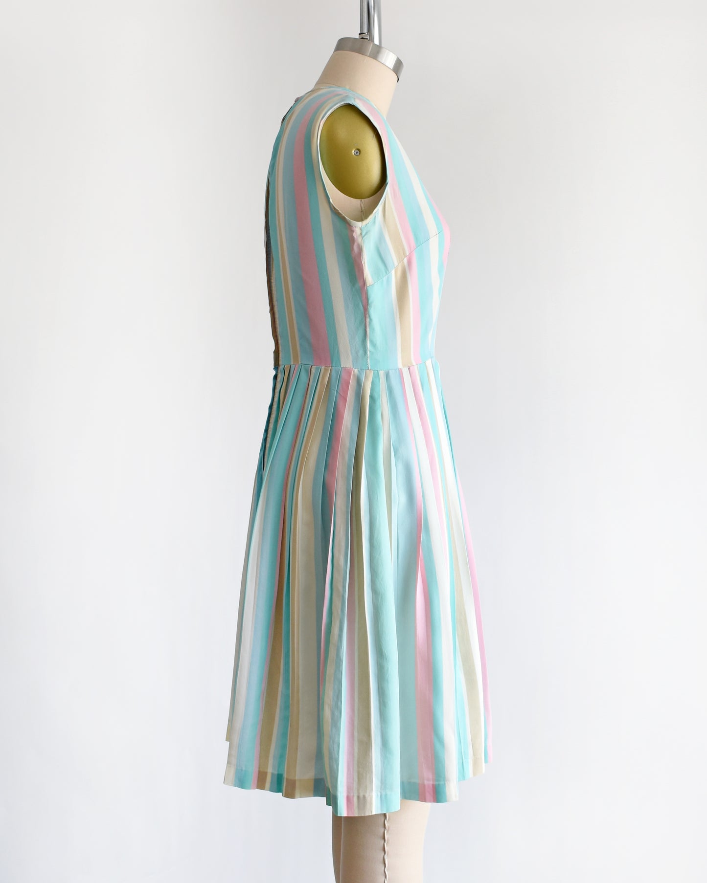 side view of a vintage 1960s striped pastel rainbow dress