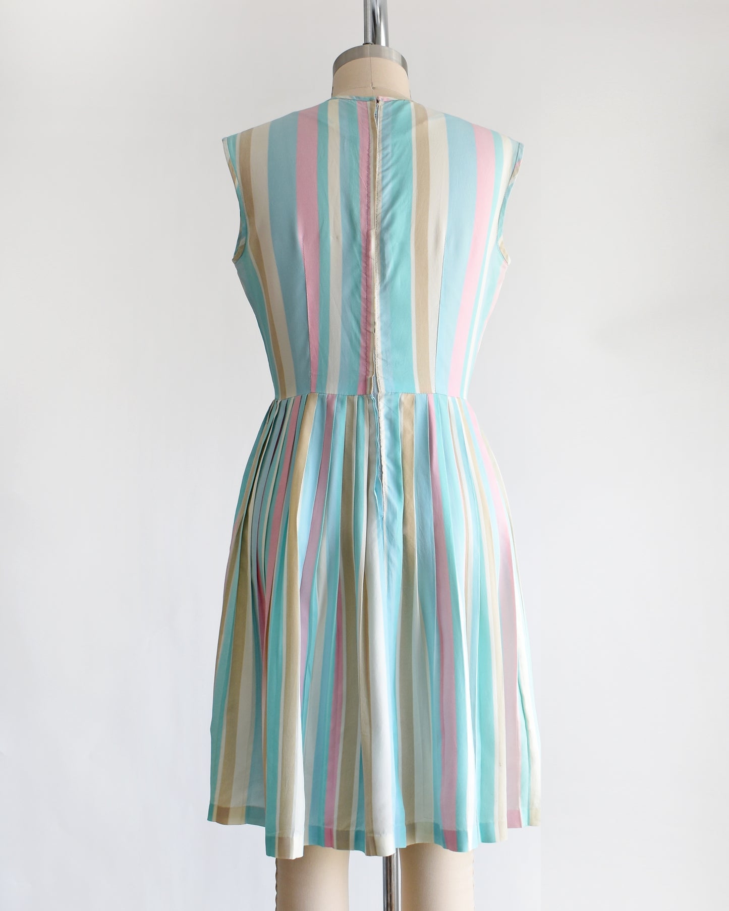 back view of a vintage 1960s striped pastel rainbow dress