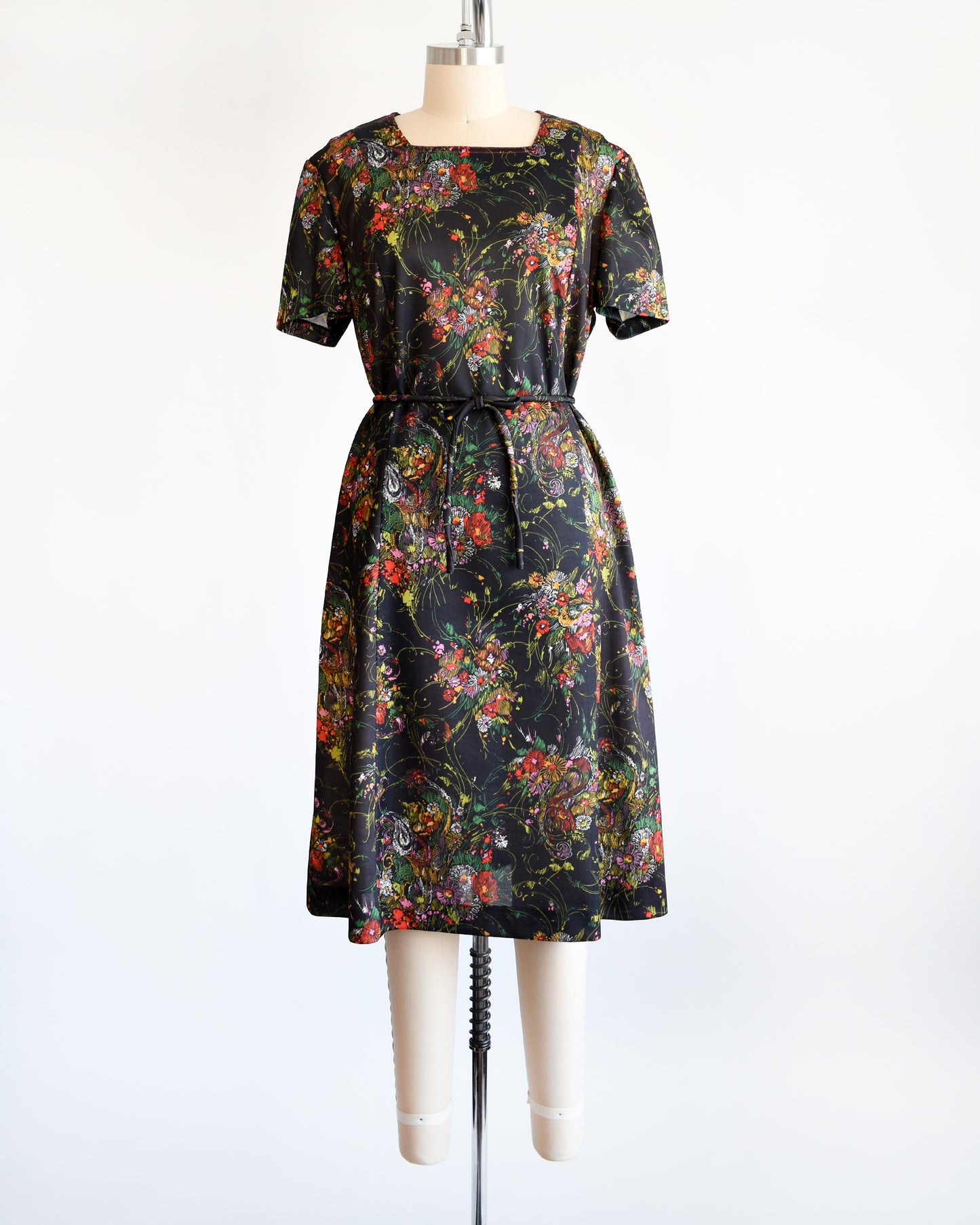 a vintage 1970s black floral dress set that comes with a dress and belt