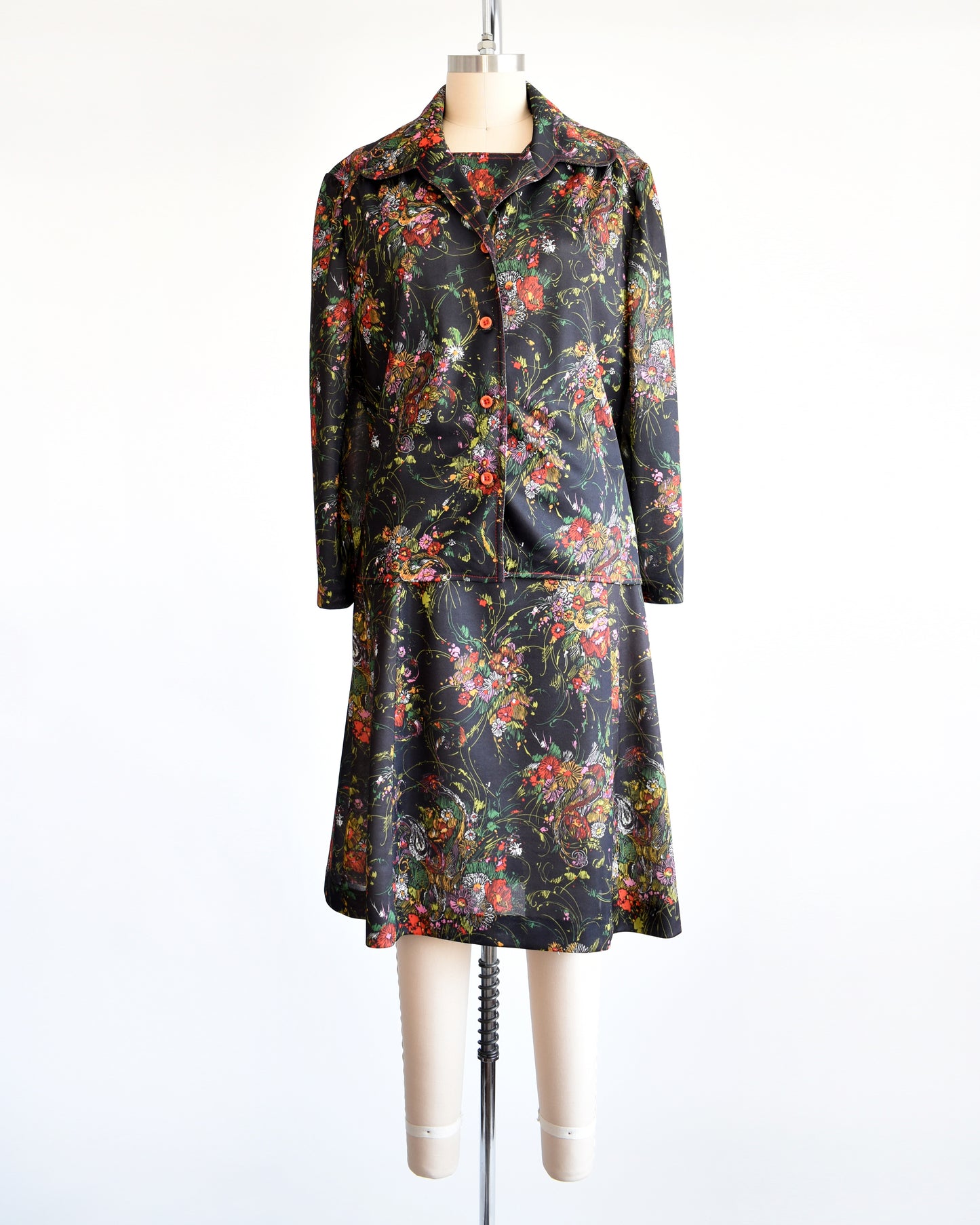 a vintage 1970s black floral dress set that comes with a dress and a matching top