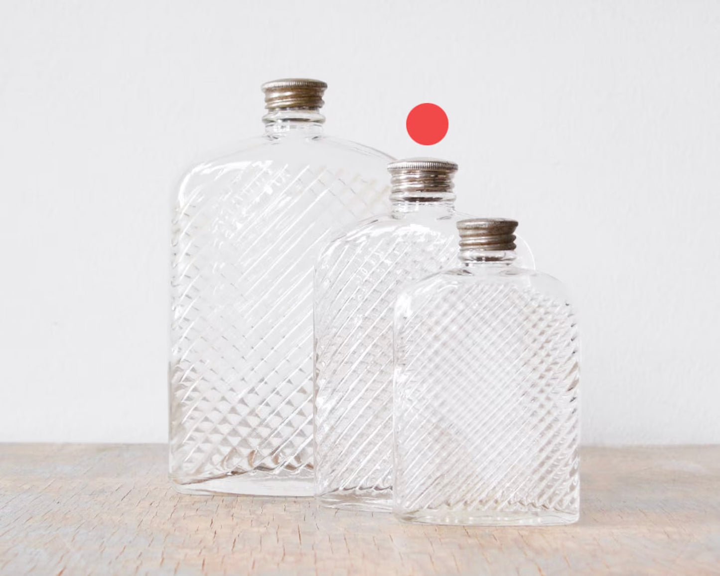 size of various flasks. the red dot indicates the size of the flask for sale.