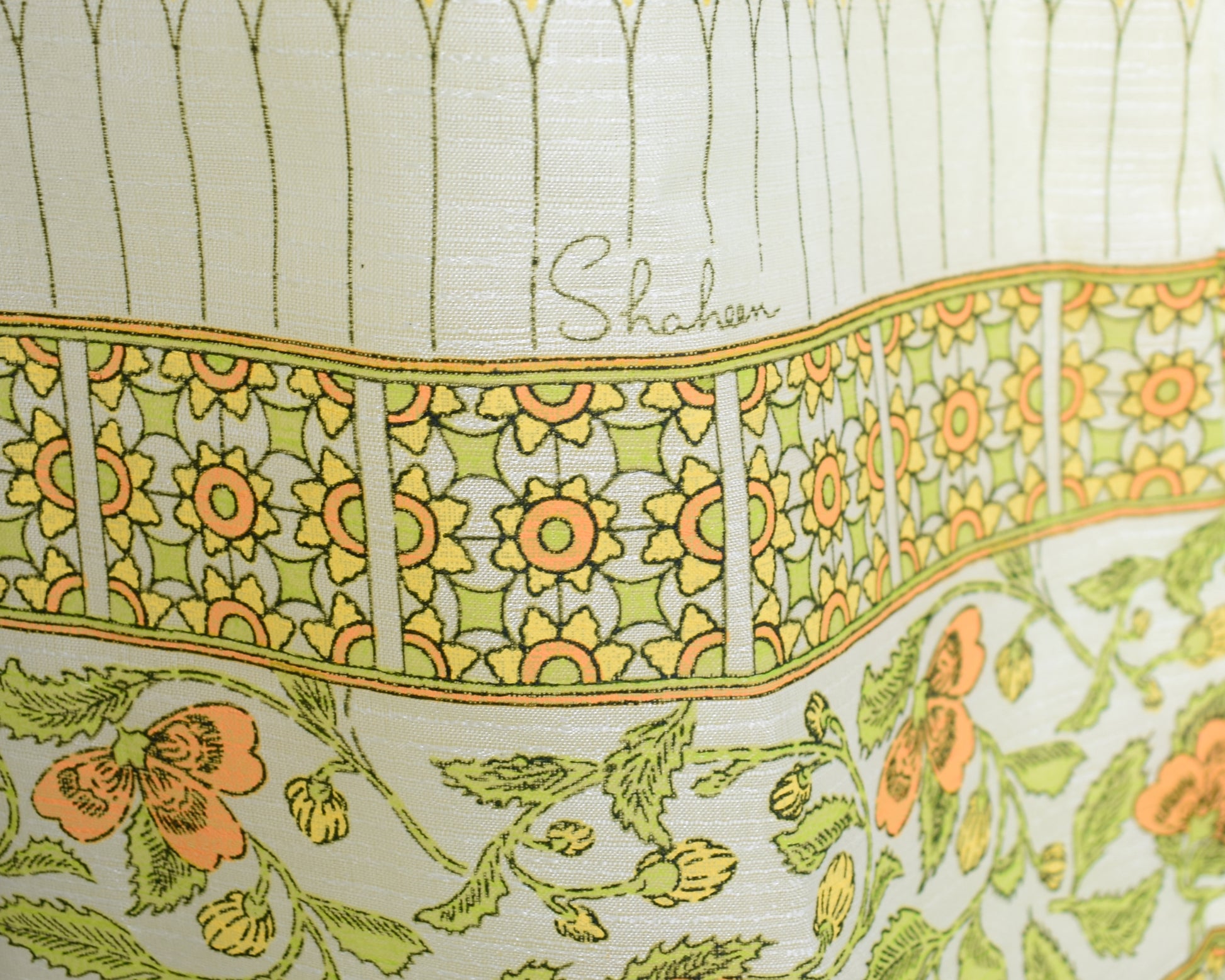 Close up of the floral print along with the iconic Shaheen signature