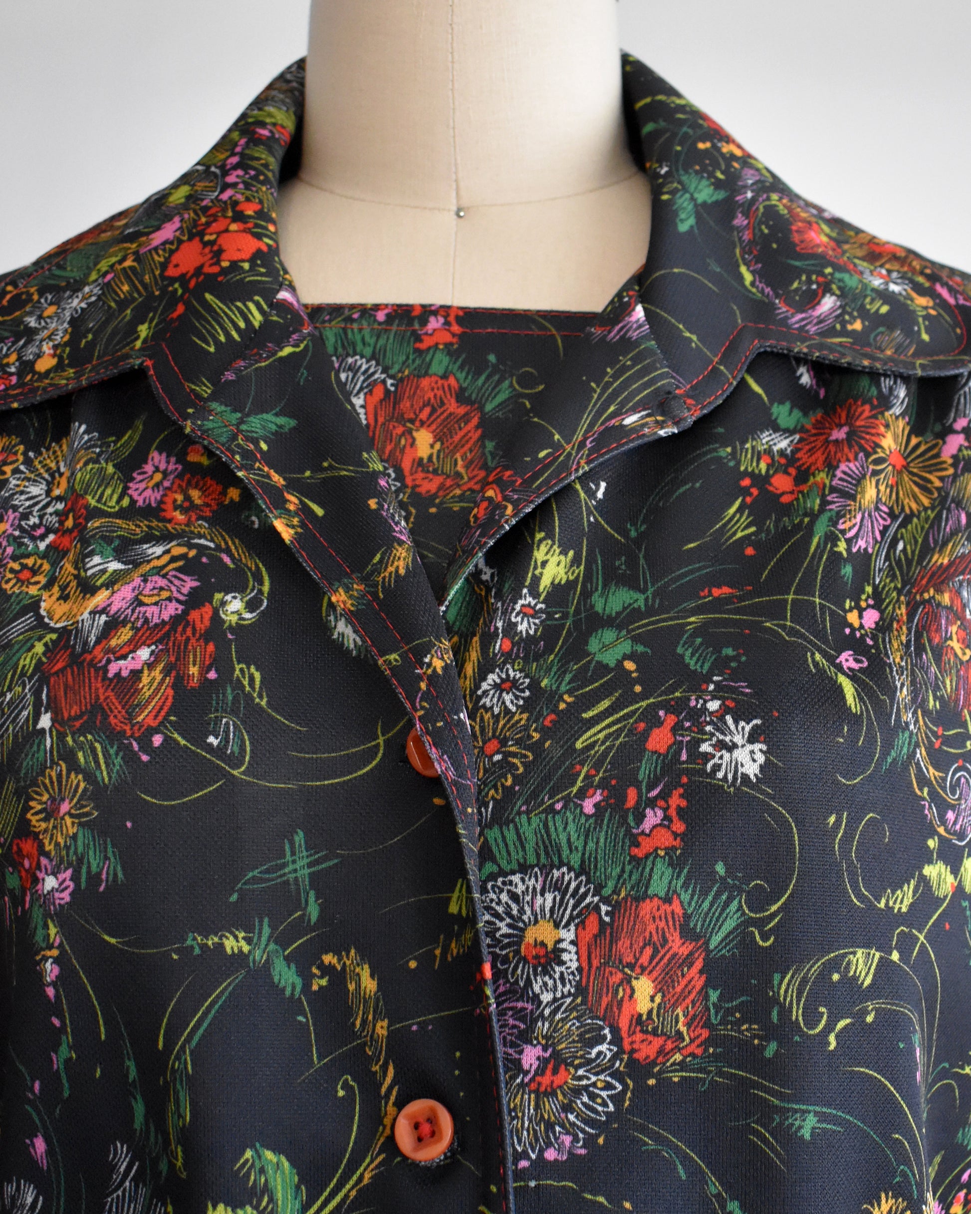 close up of the neckline of the top and dress