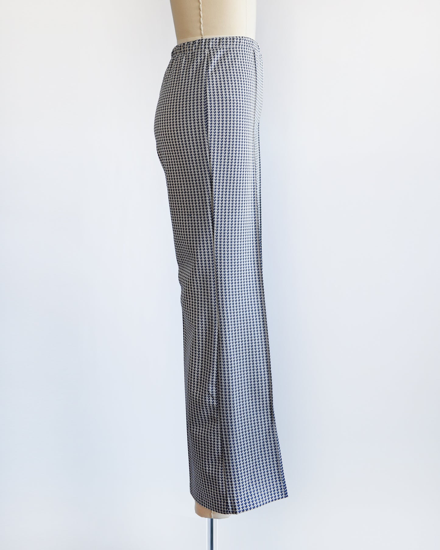 side view of a pair of vintage 1970s wide leg pants with houndstooth print