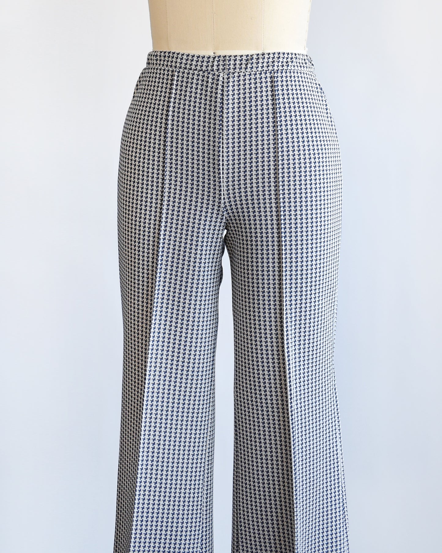 side front view of a pair of vintage 1970s wide leg pants with houndstooth print