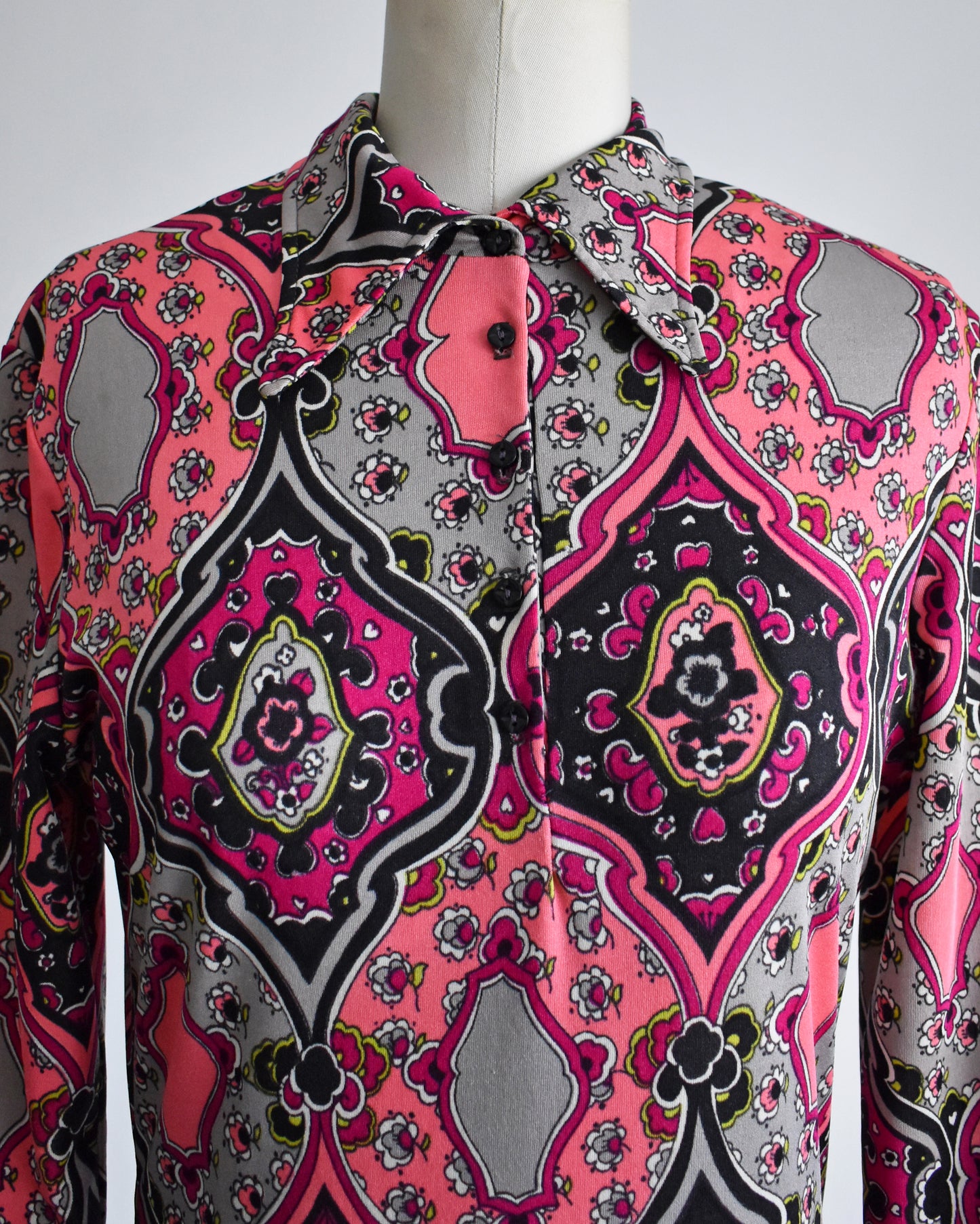 close up of the dagger collar and 5 buttons on the blouse