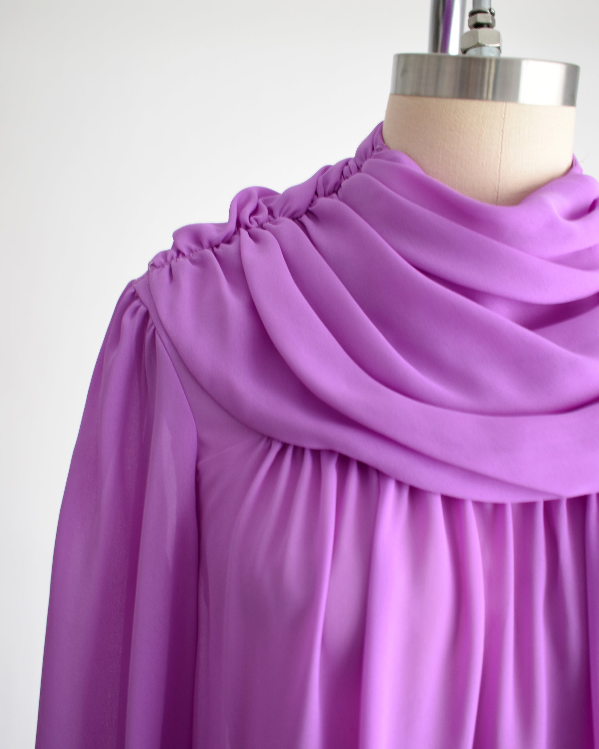 close up of the gathered shoulders and draped neckline