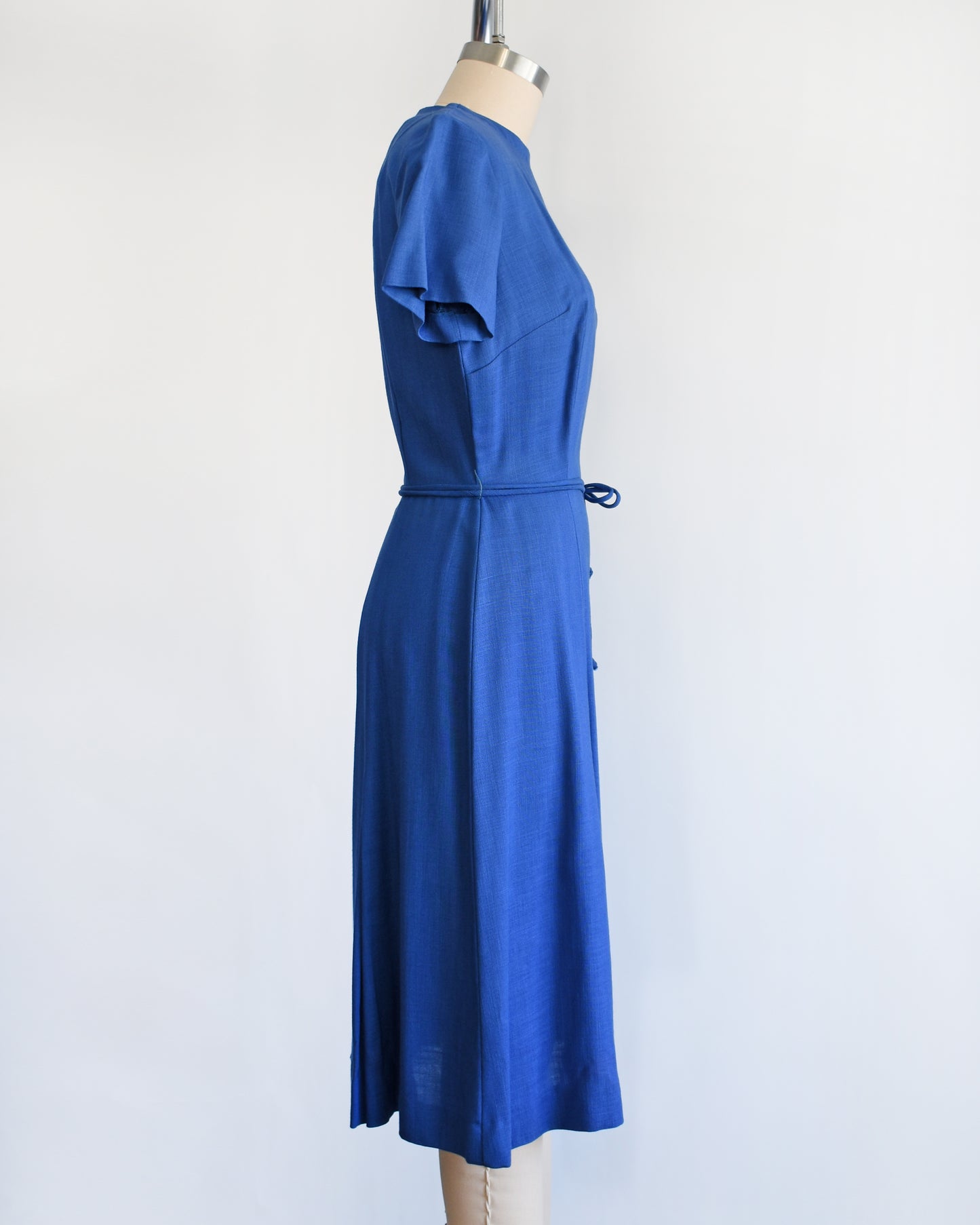 side view of a vintage 1960s cobalt blue day dress by Alison Ayers