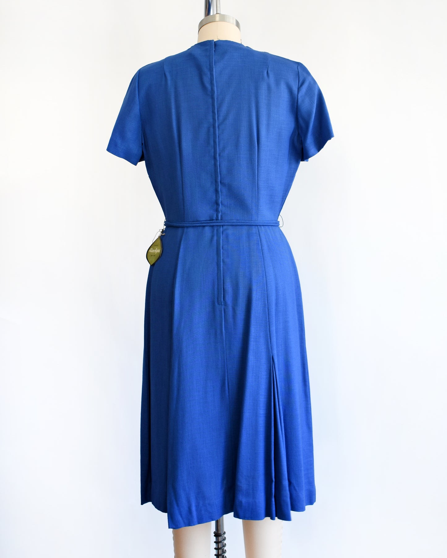 back view of a vintage 1960s cobalt blue day dress by Alison Ayers
