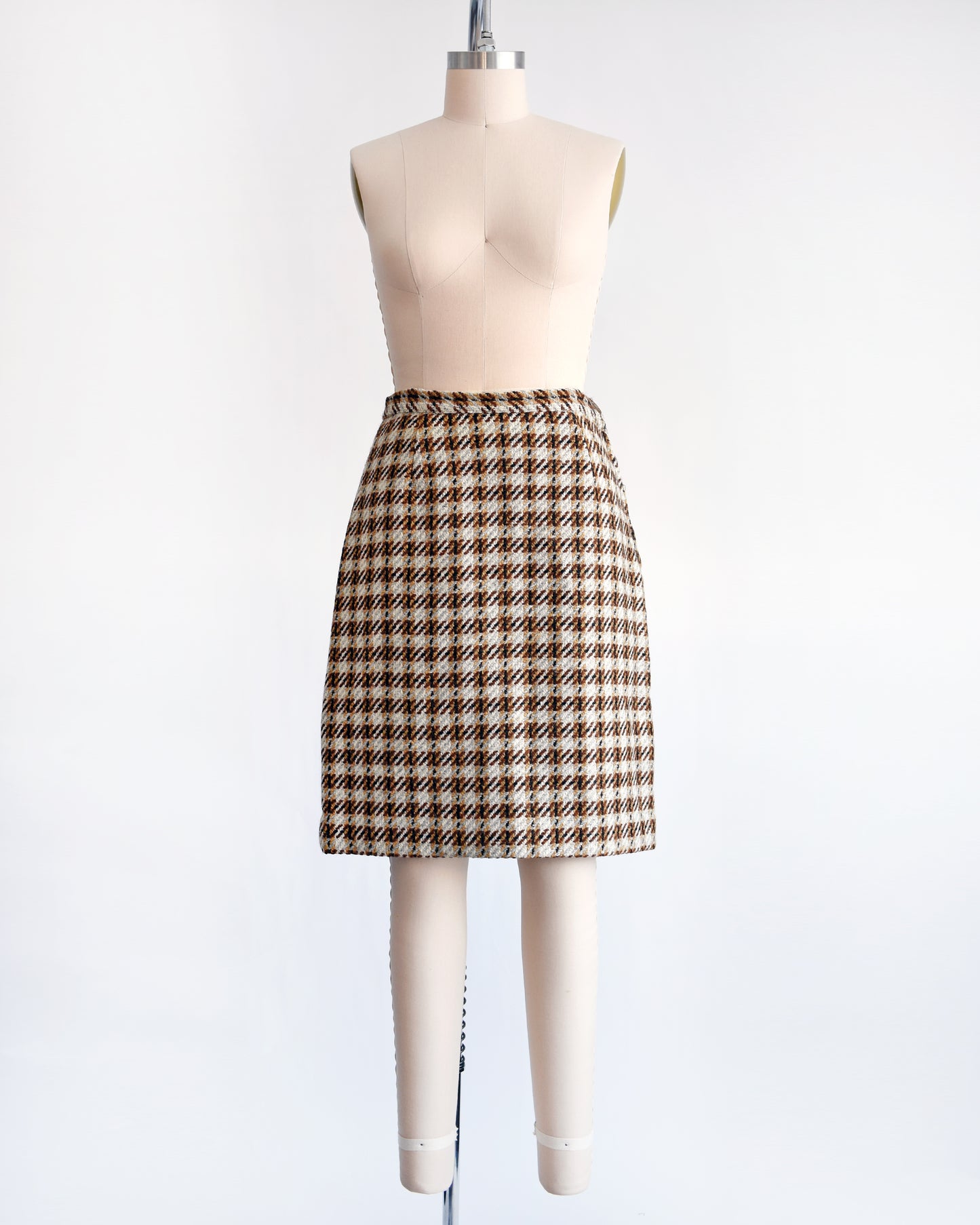 a vintage 1960s brown plaid wool skirt