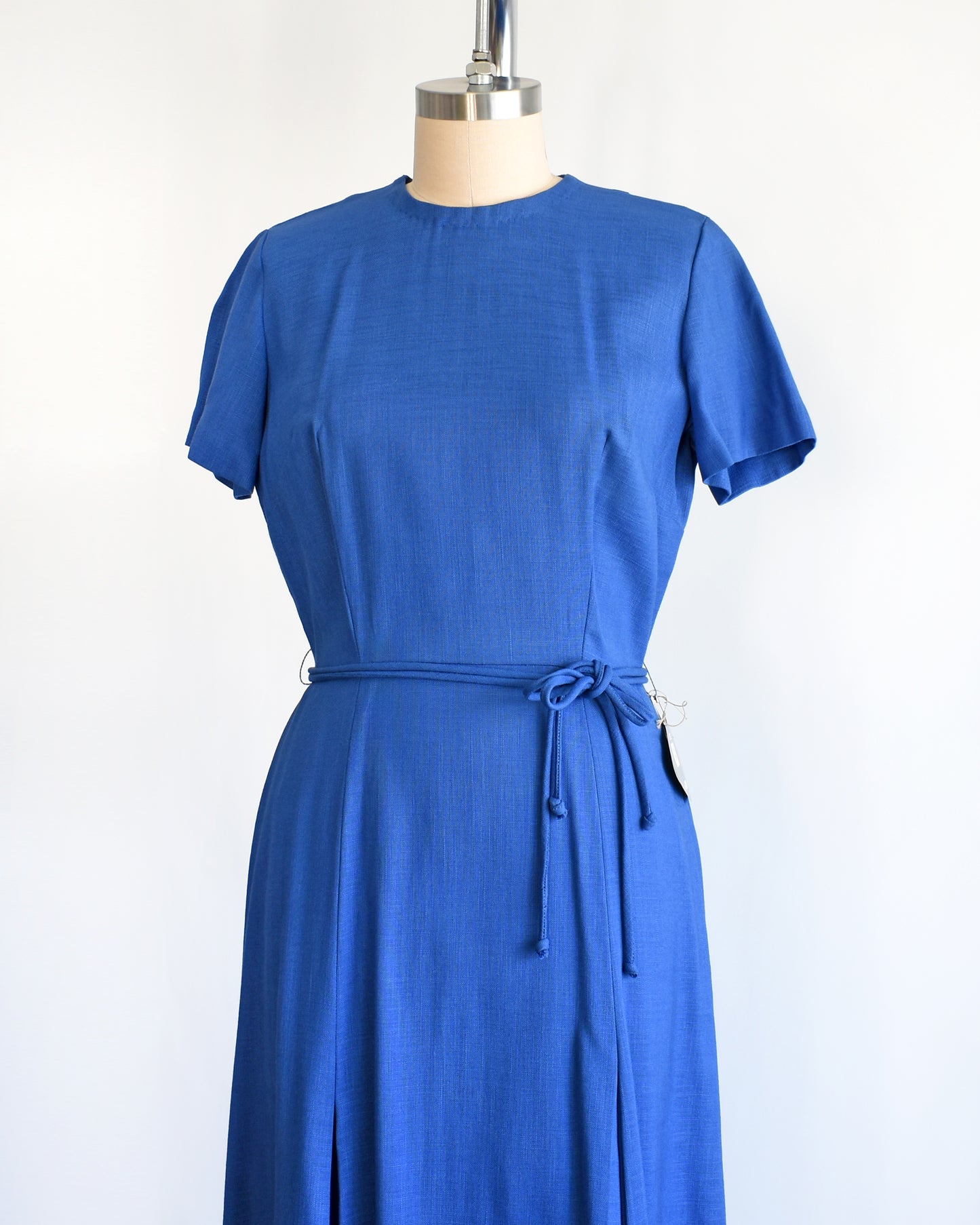 side front view of a vintage 1960s cobalt blue day dress by Alison Ayers
