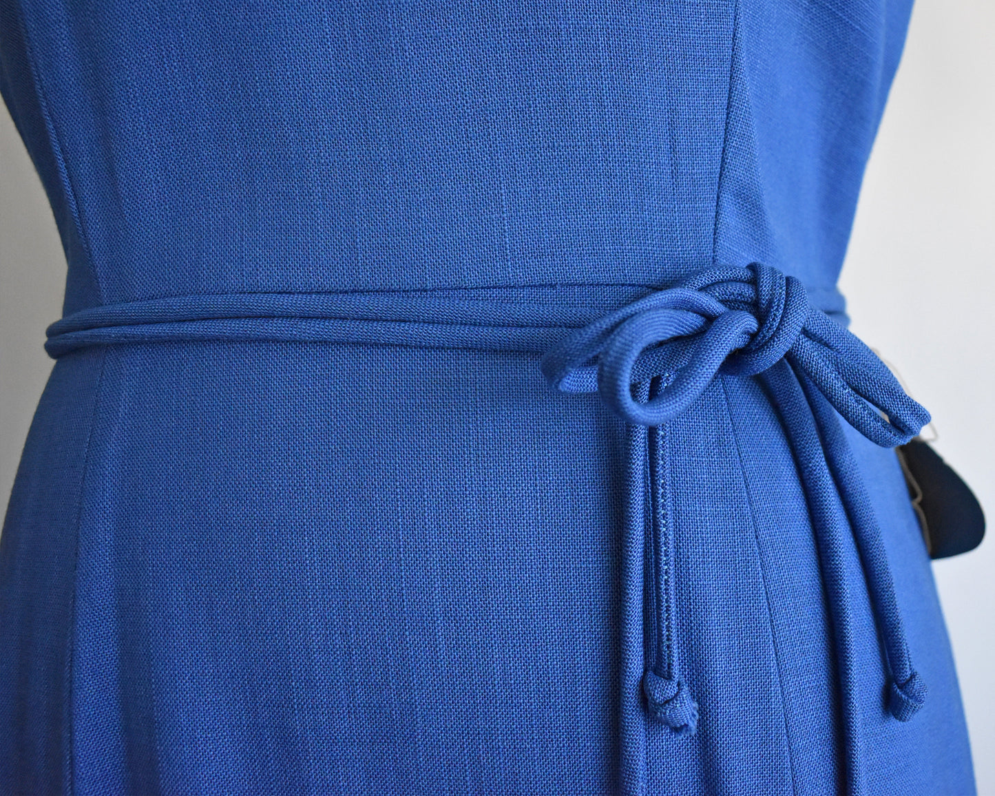 close up of the waist on a vintage 1960s cobalt blue day dress by Alison Ayers