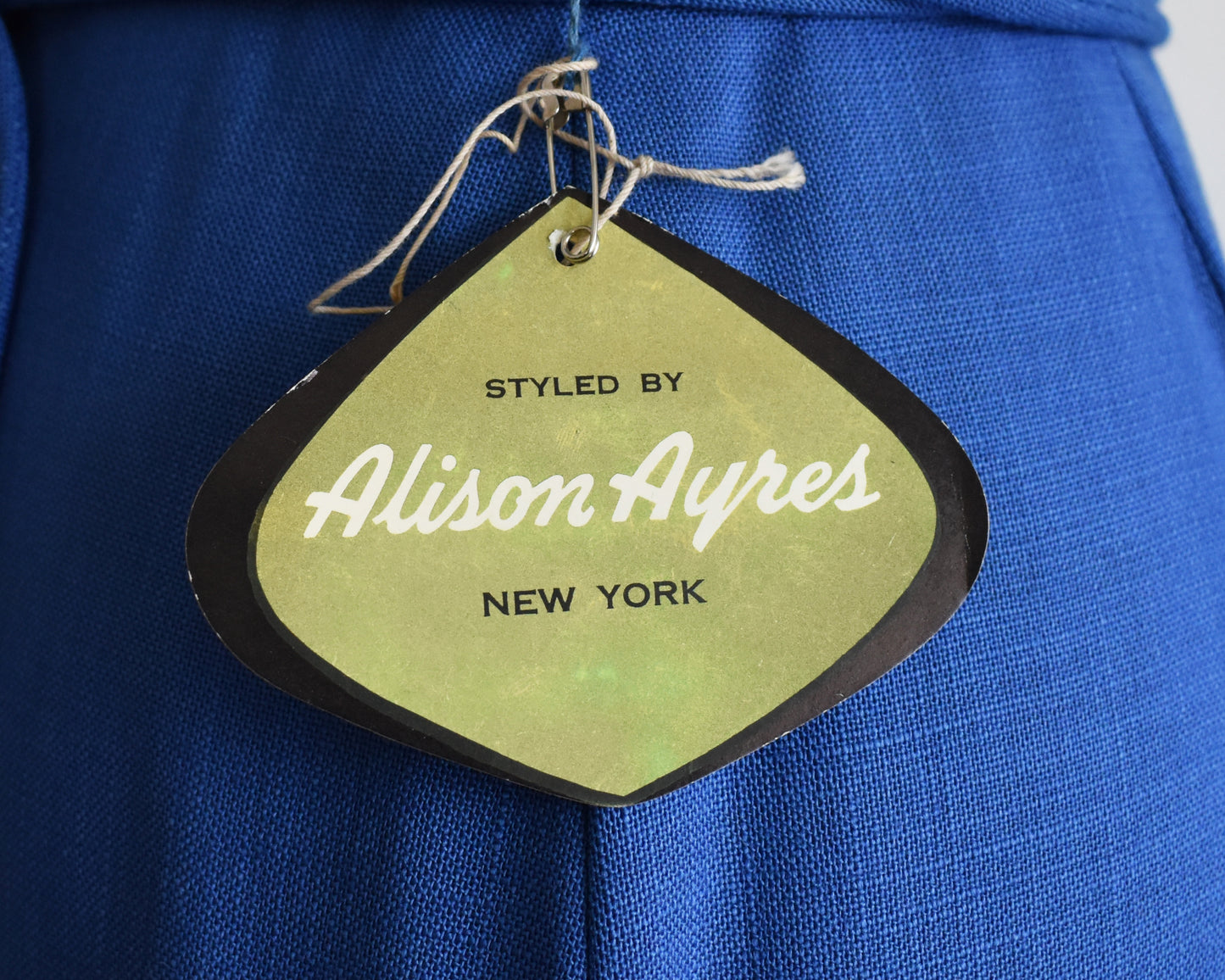 close up of the tag which says Styled by Alison Ayers New York