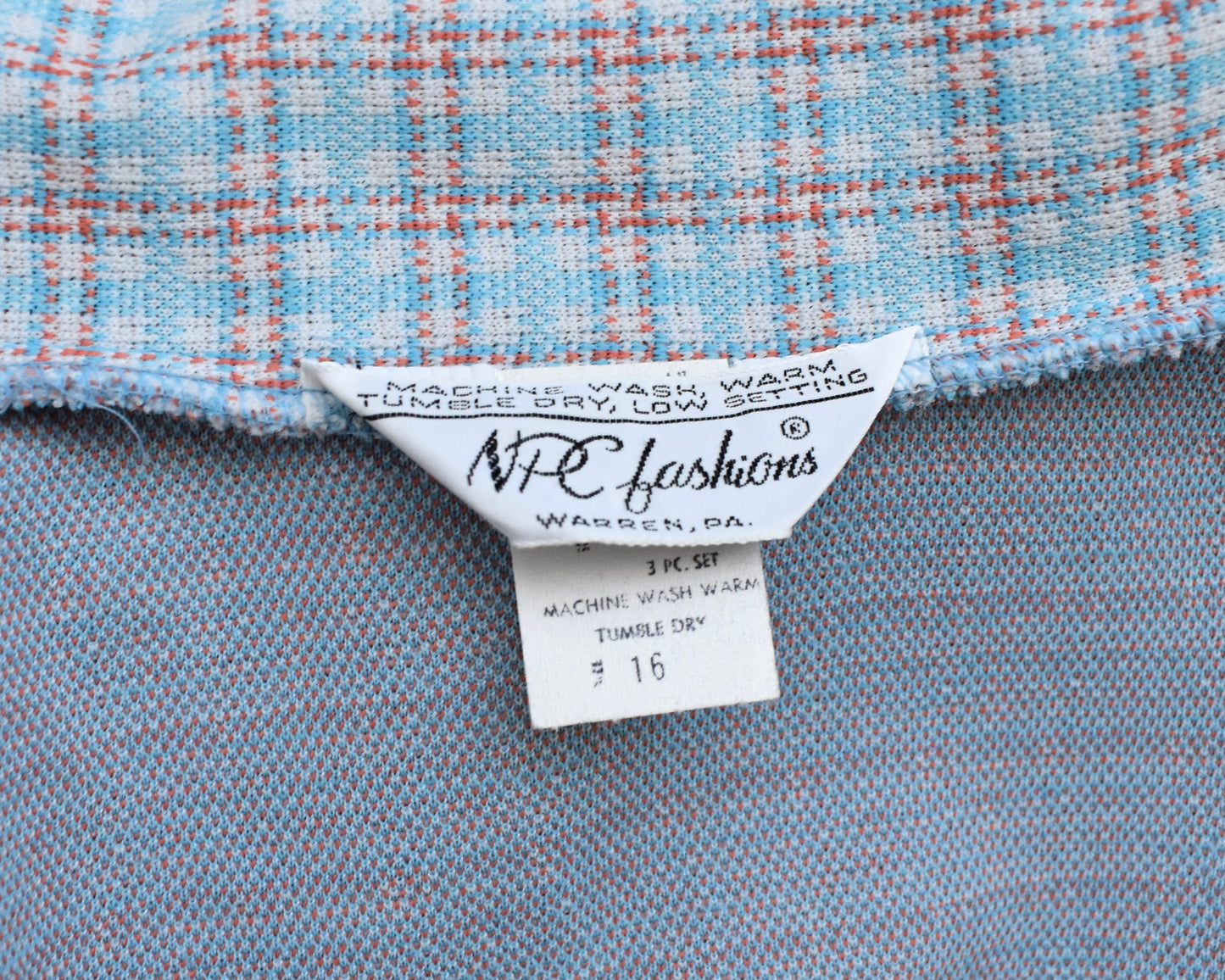 Close up of the tag which says NPC Fashions