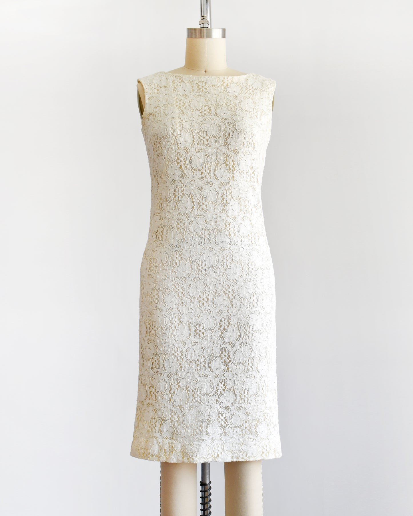 a vintage 1960s floral cream lace dress