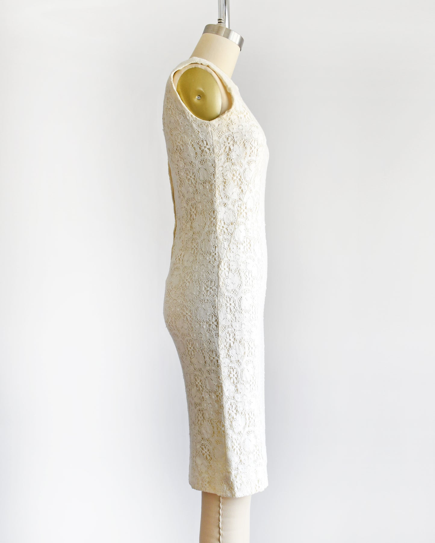 side view of a vintage 1960s floral cream lace dress