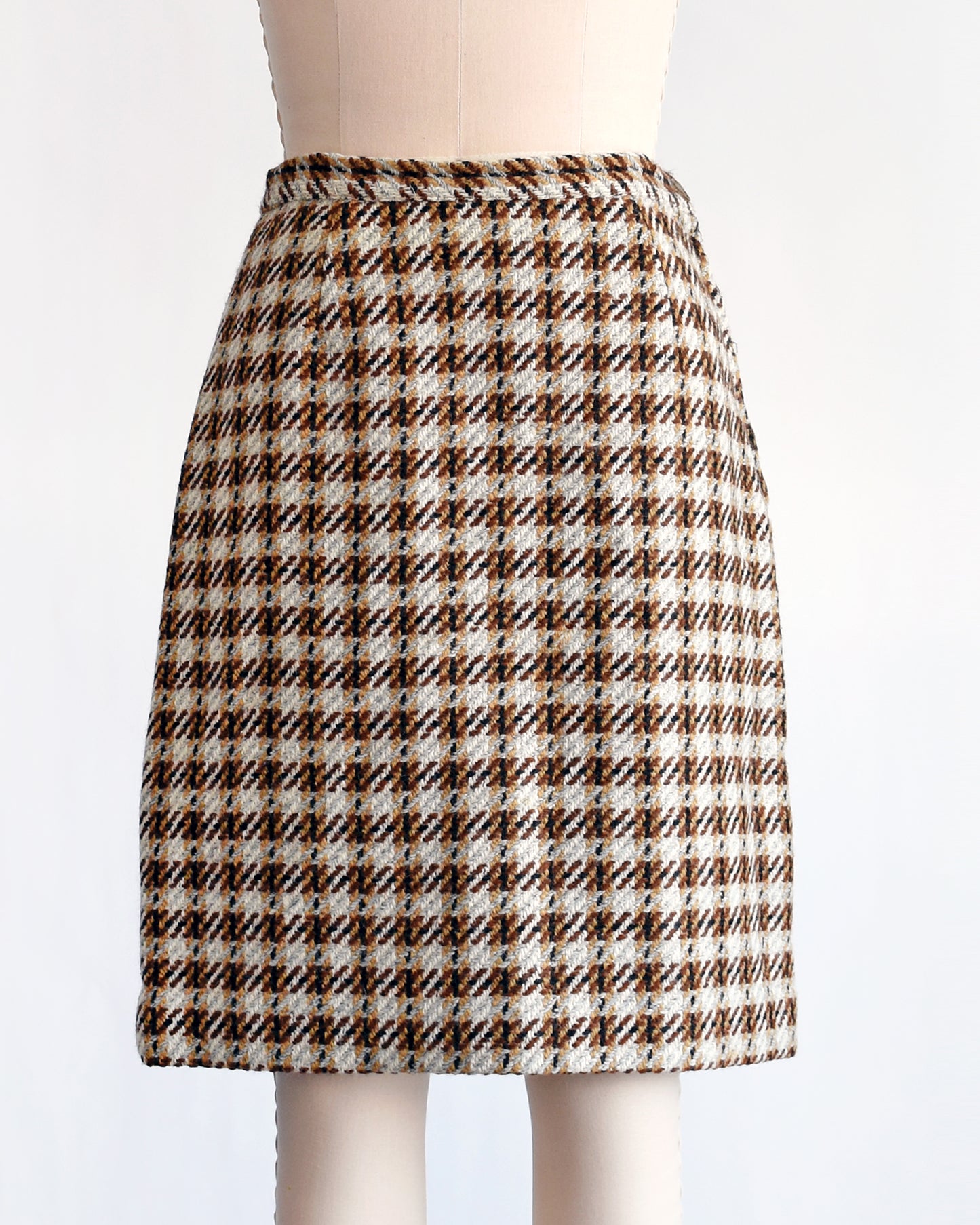 a vintage 1960s brown plaid wool skirt