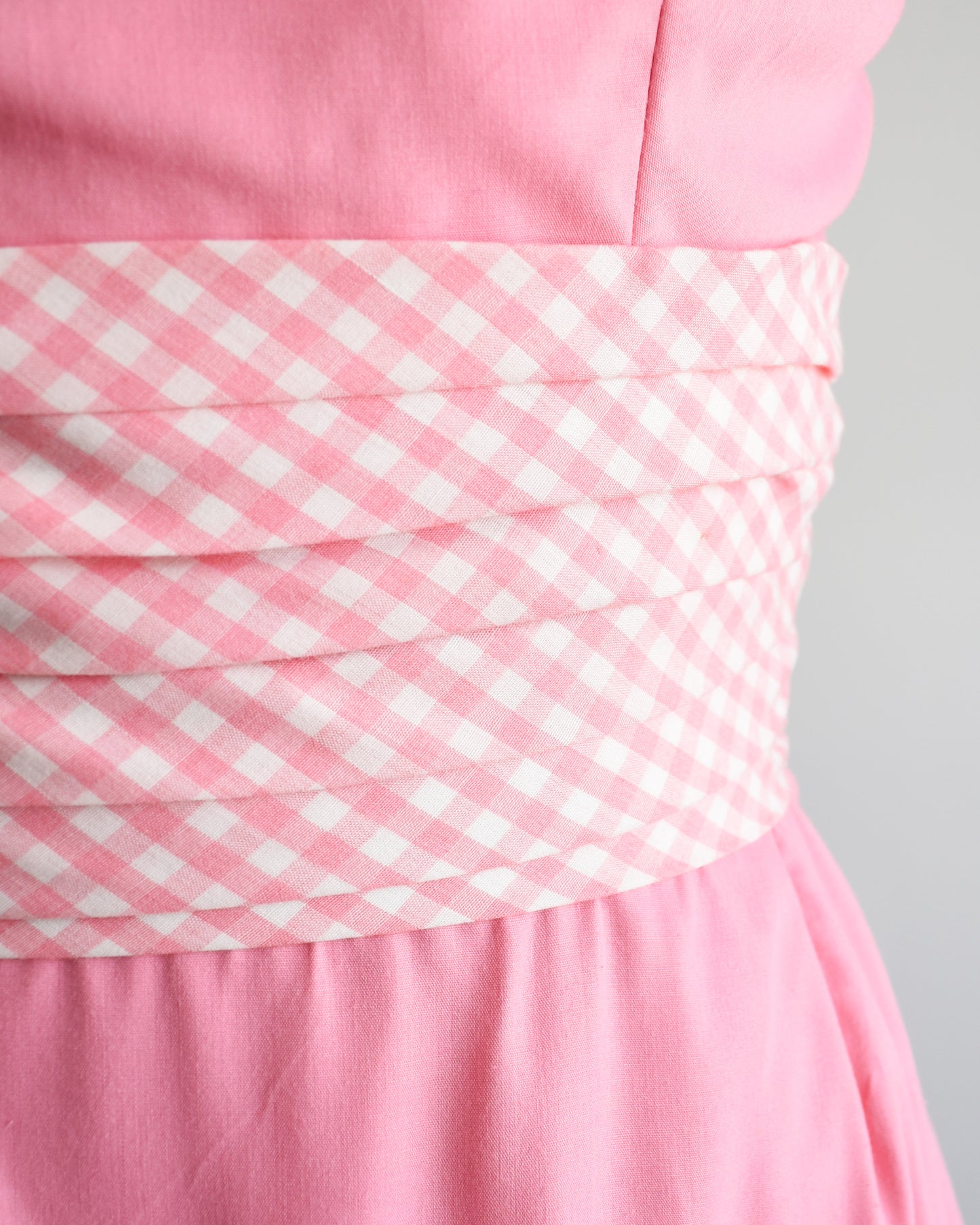 close up of the pink and white gingham waistband