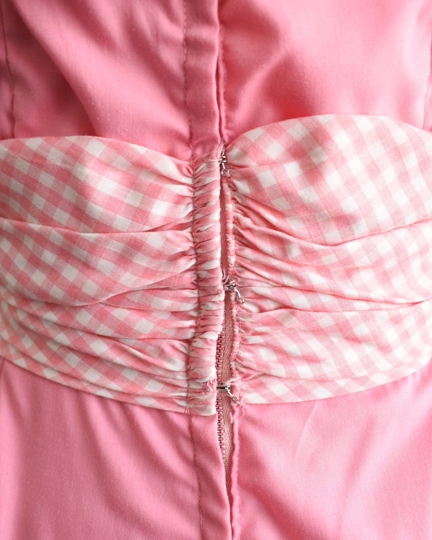close up of the hooks on the back of the dress