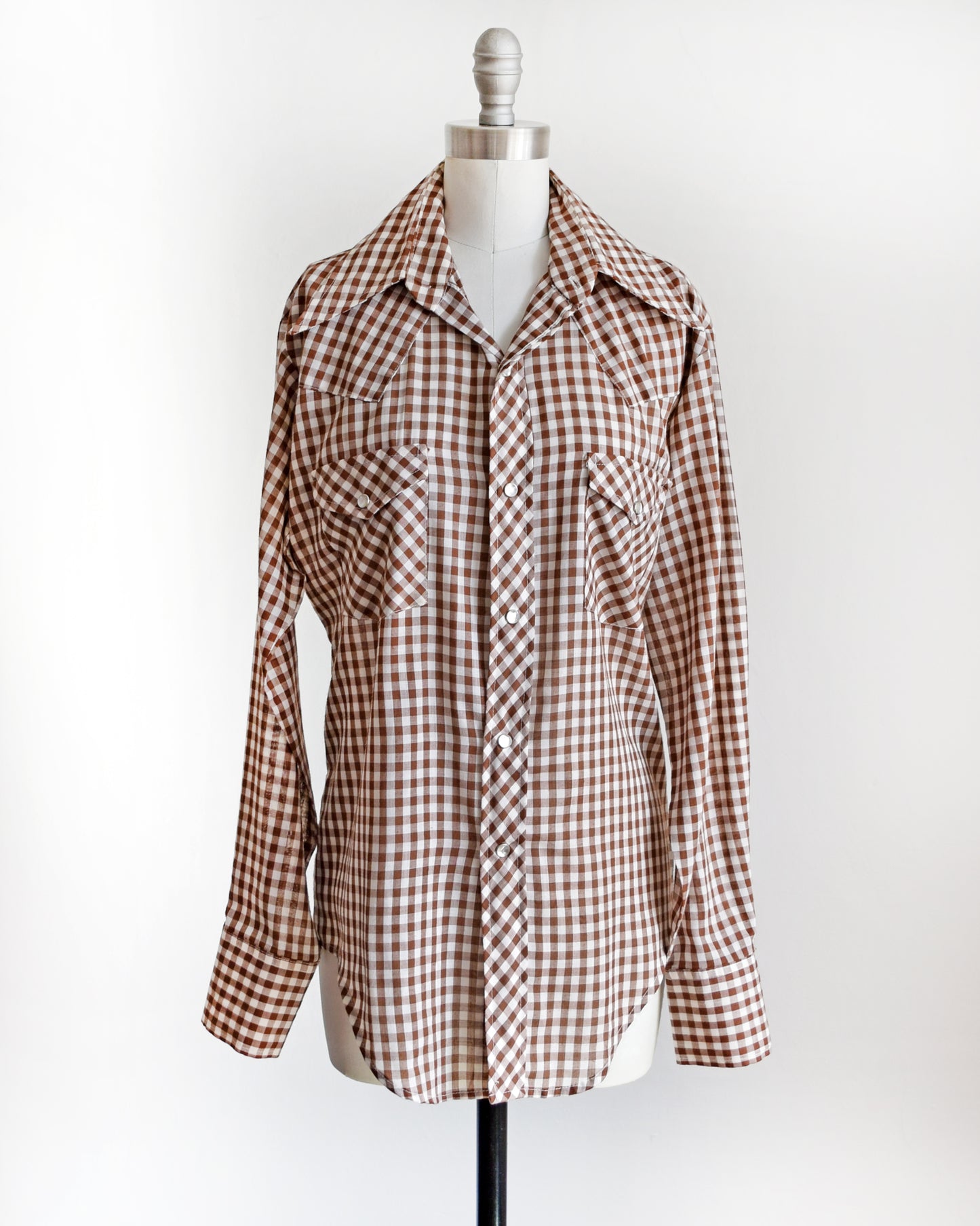 a vintage 1970s brown and white gingham pearl snap shirt