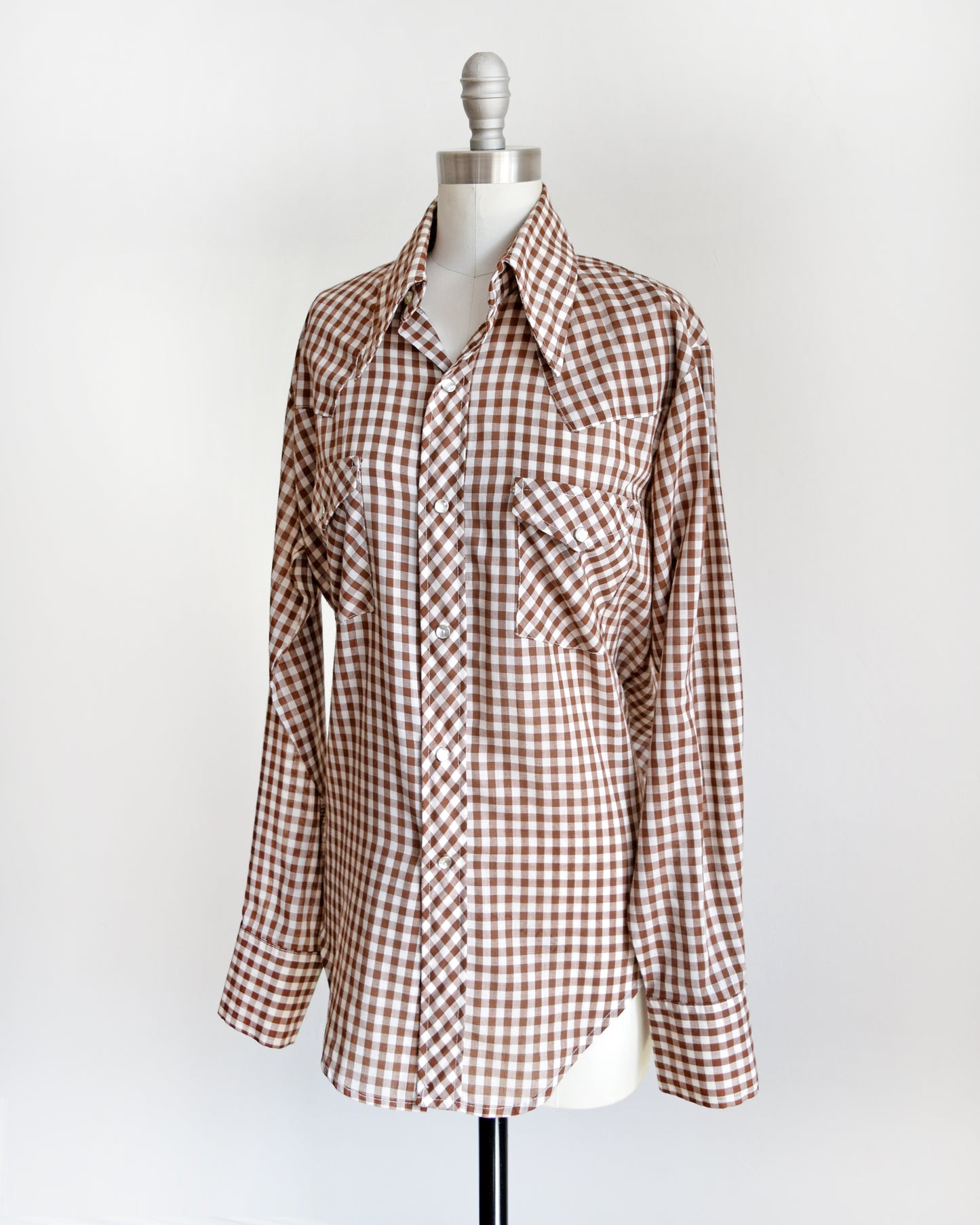 side front view of a vintage 1970s brown and white gingham pearl snap shirt