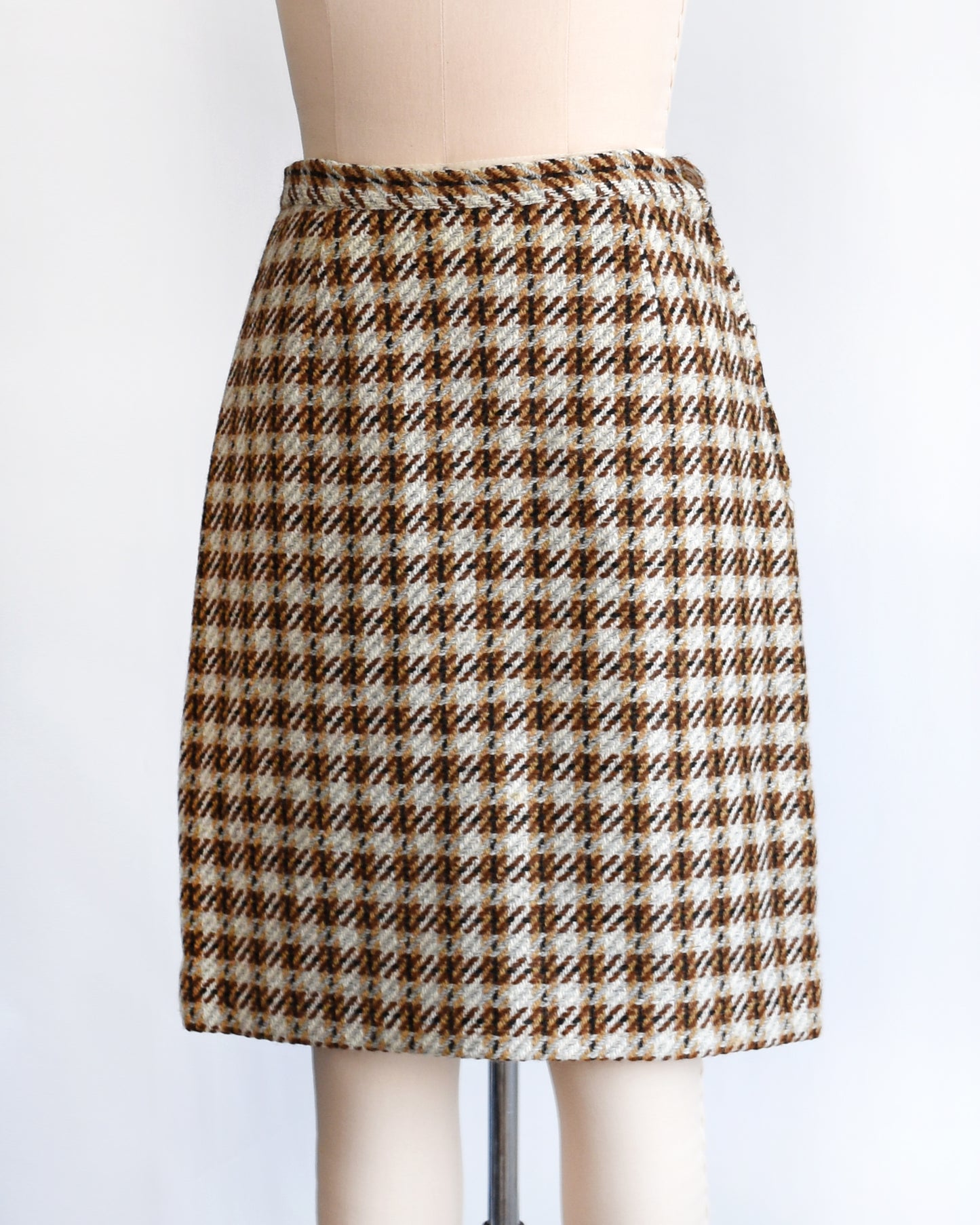 side front view of a vintage 1960s brown plaid wool skirt