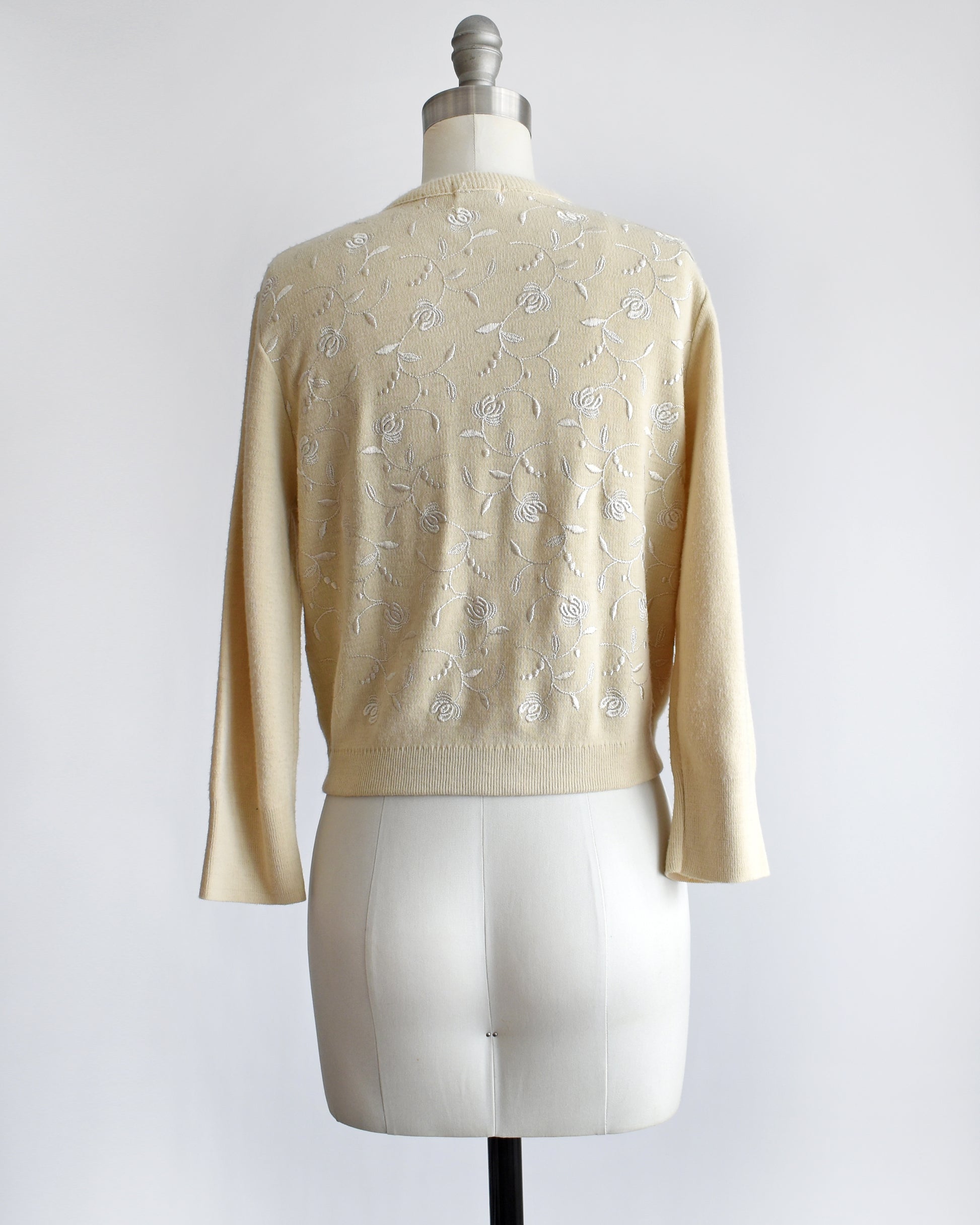 back view of a vintage 1960s embroidered floral cardigan