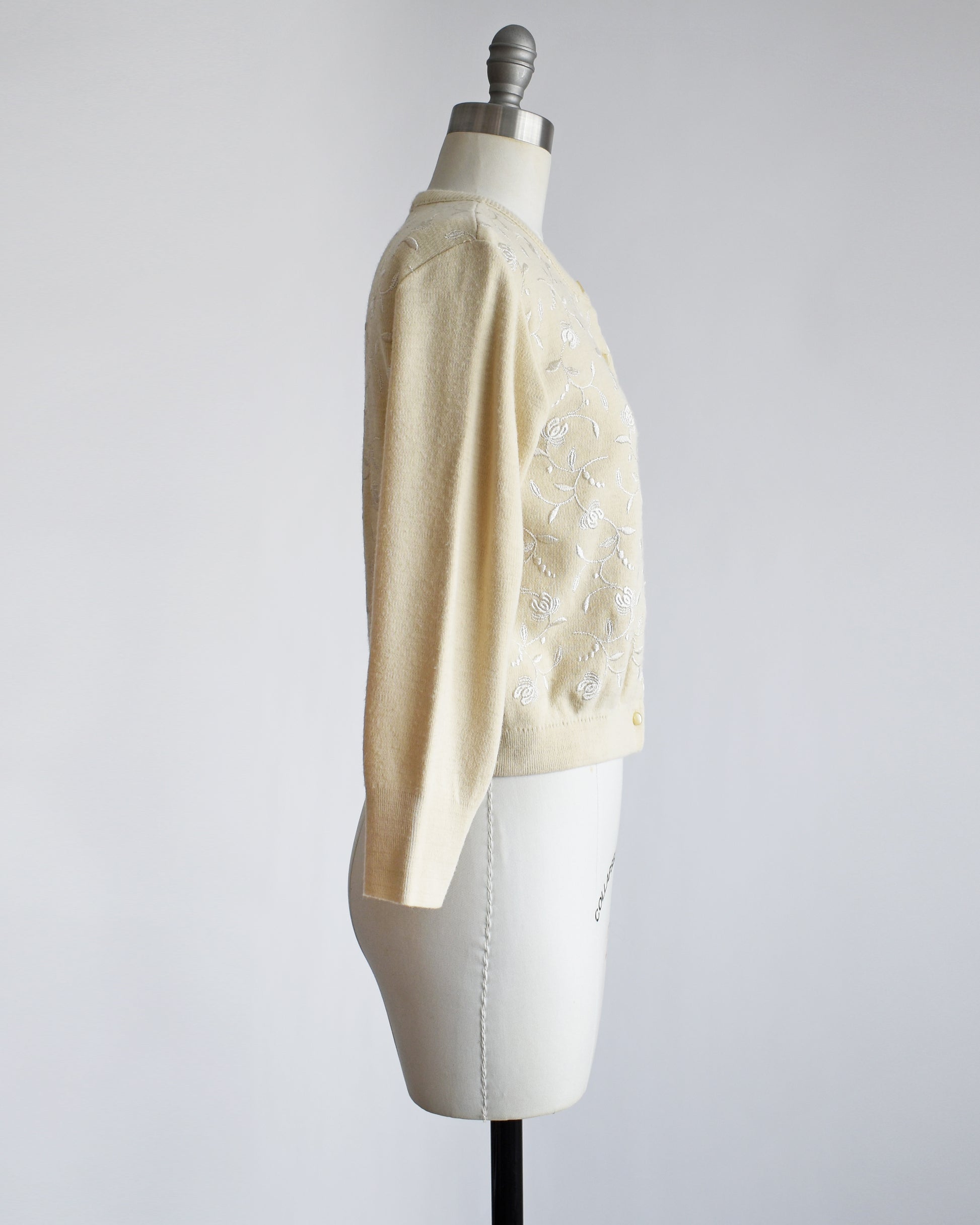 side view of a vintage 1960s embroidered floral cardigan