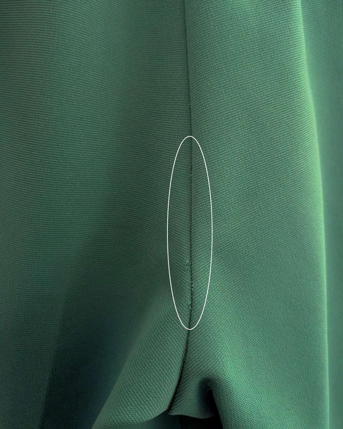 close up of some small snags on the back seam of the pants