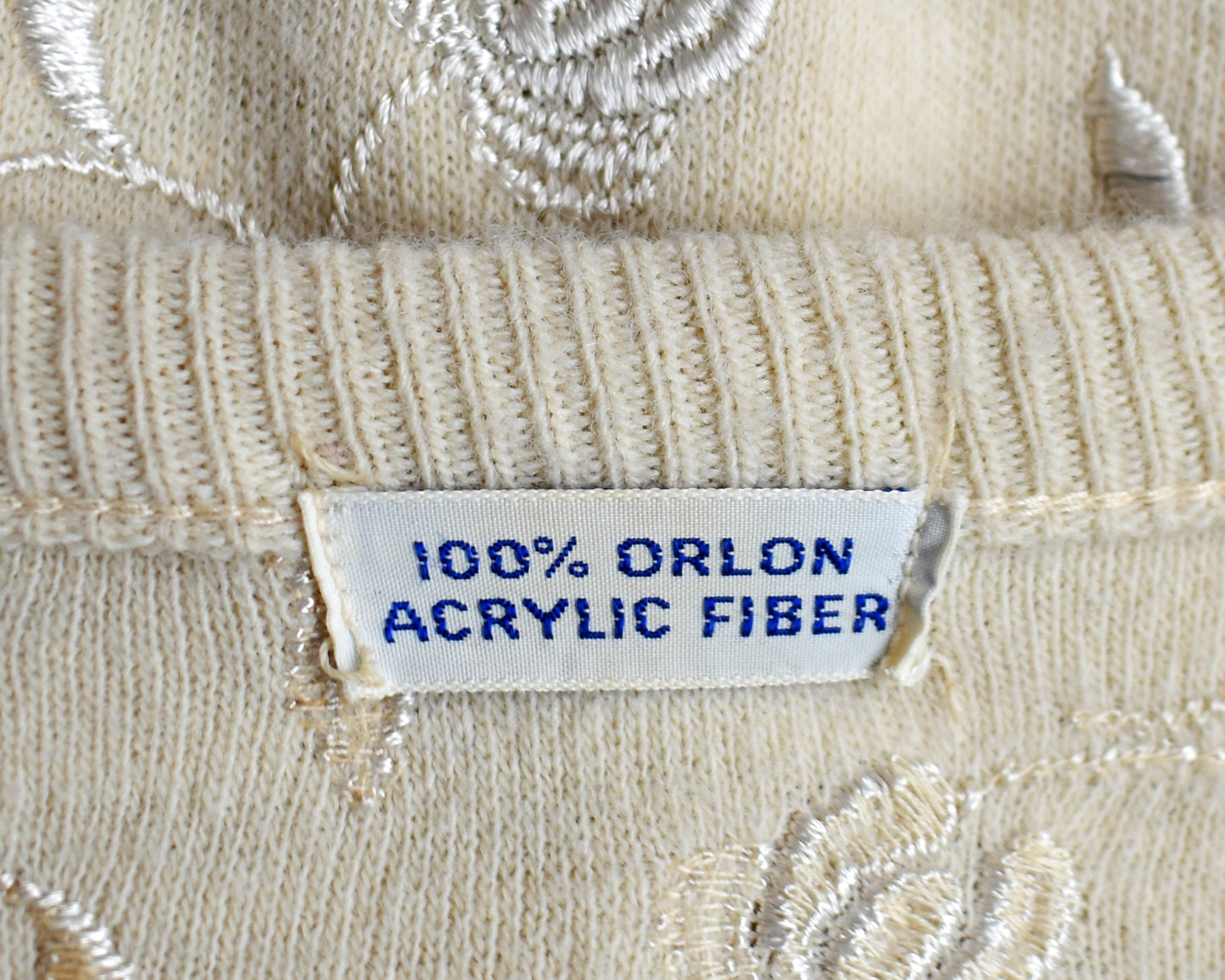 close up of the tag which says 100% orlon acrylic fiber