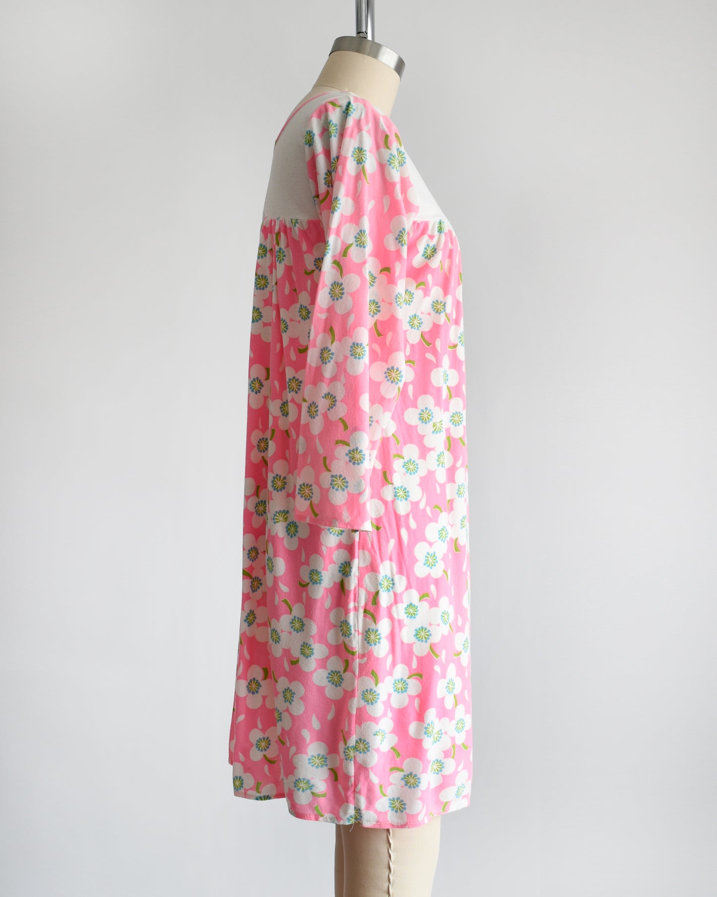side view of a vintage 1970s pink flower power nightgown