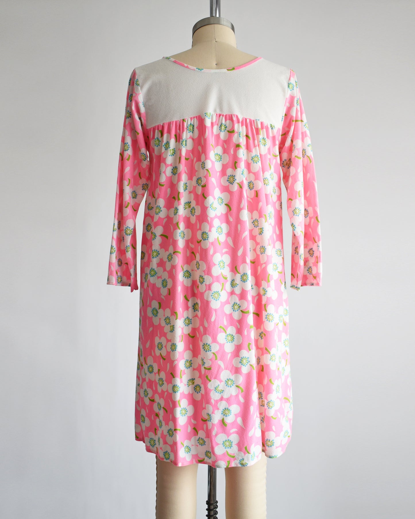 back view of a vintage 1970s pink flower power nightgown