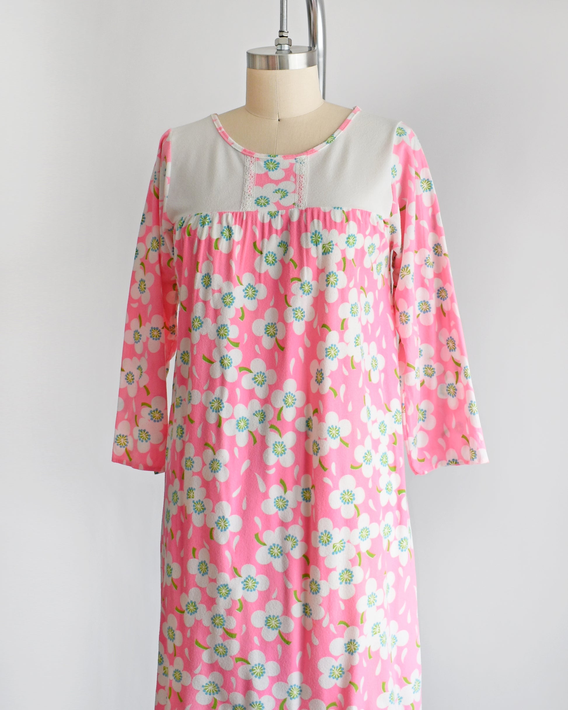 side front view of a vintage 1970s pink flower power nightgown