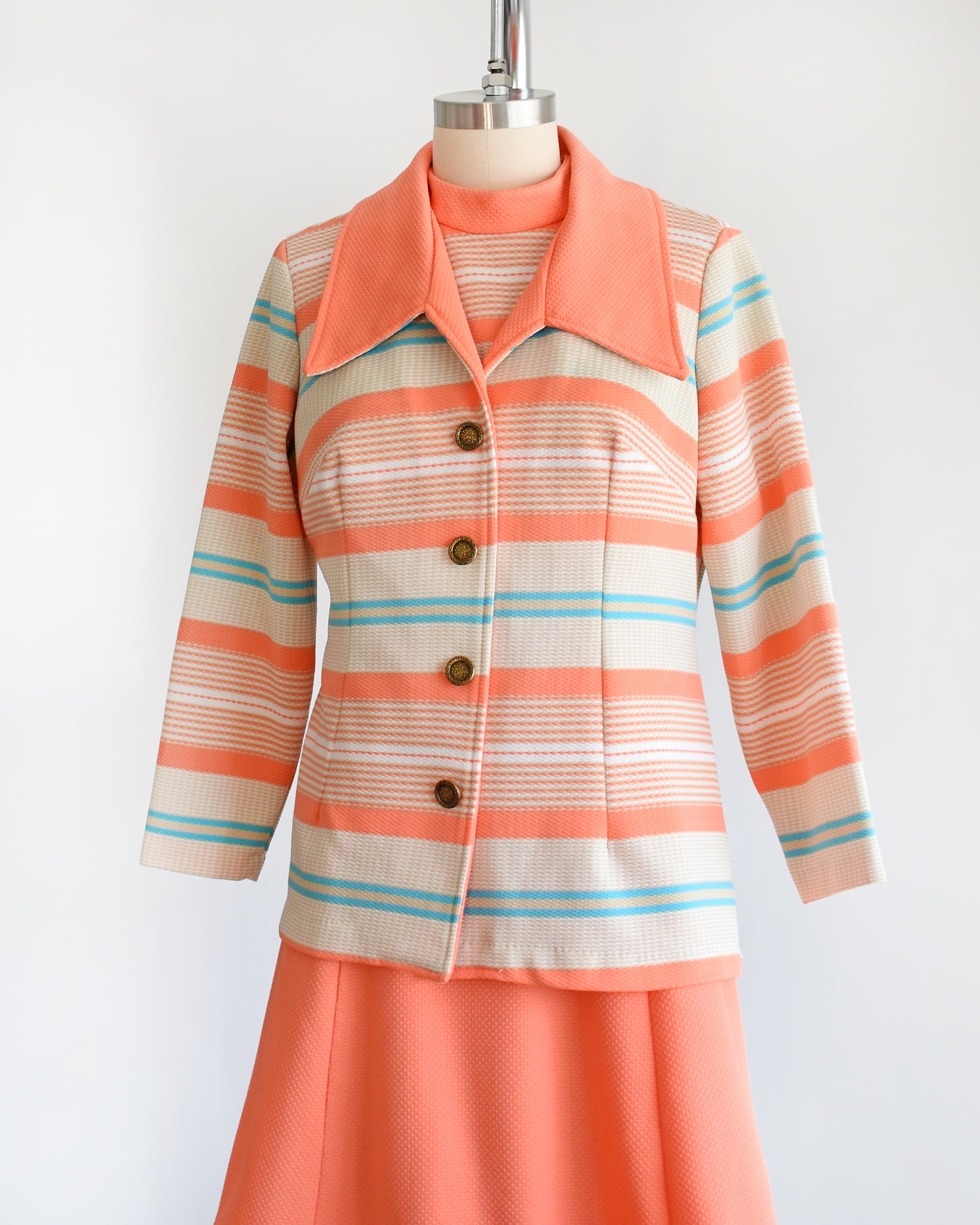Side view of a vintage 1970s peach and blue mod dress set