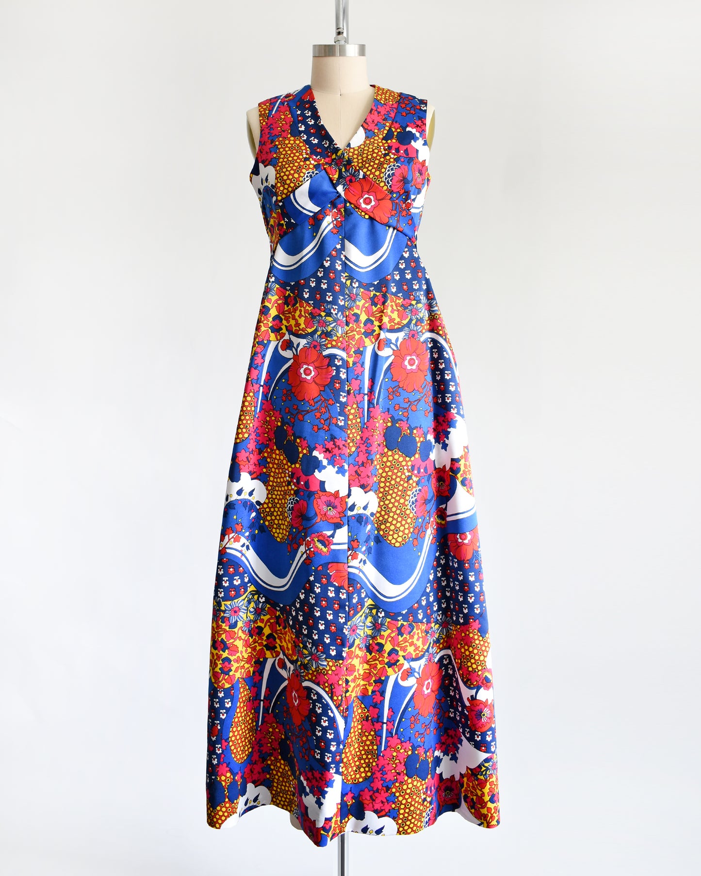 a vintage 1970s blue and multicolored floral print maxi dress