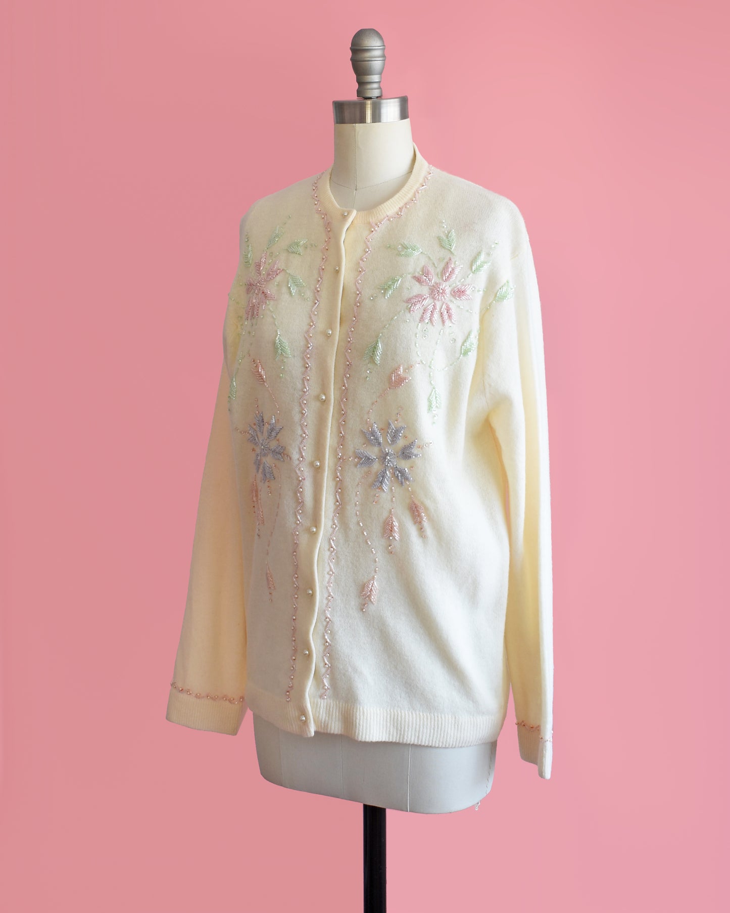 side front view of a vintage 1960s cream beaded floral cardigan.