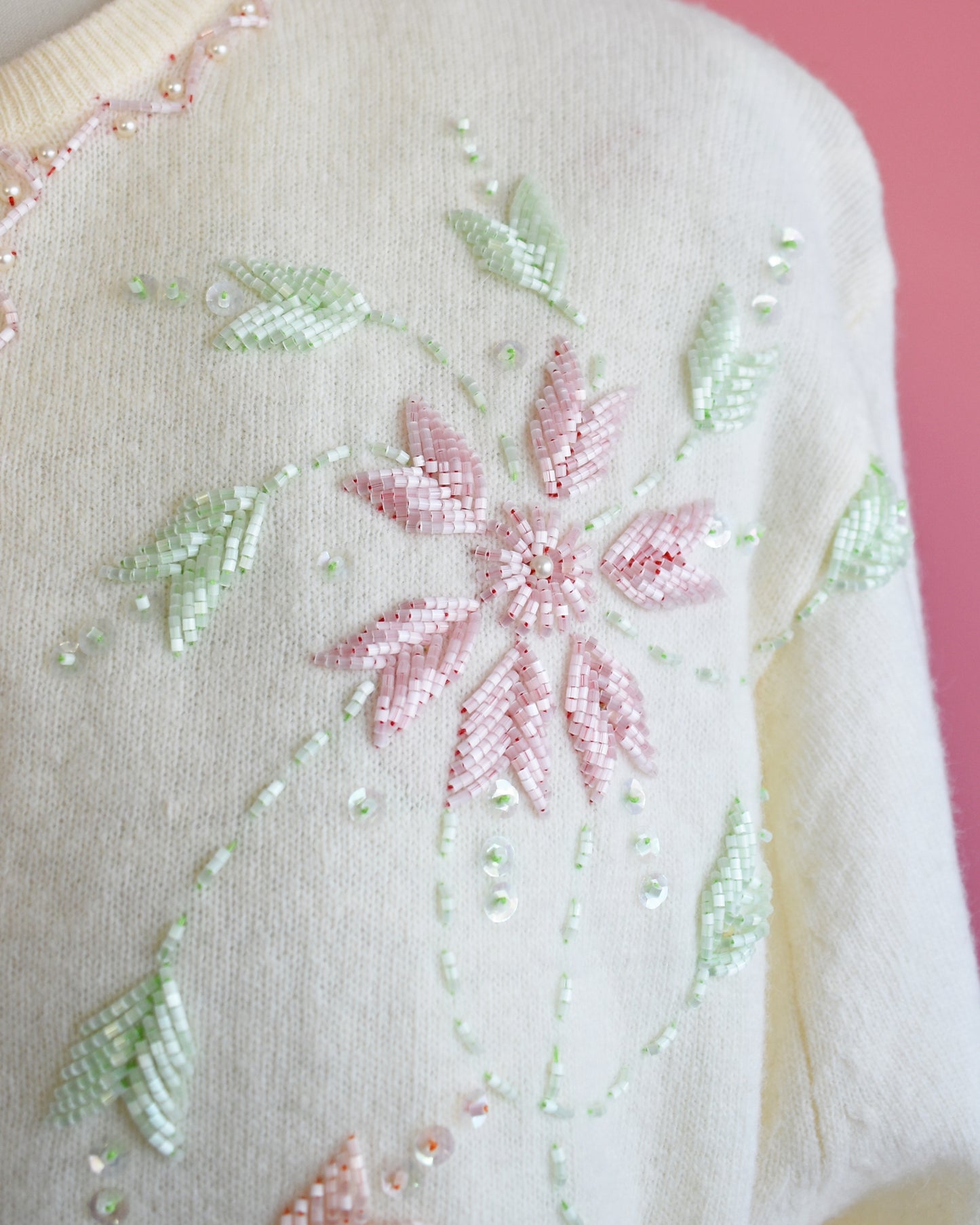 close up of the beaded floral detail on the cardigan