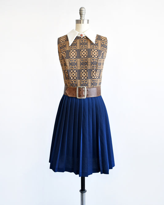 A vintage 1960s brown, blue, and white mod scooter dress with wide brown belt