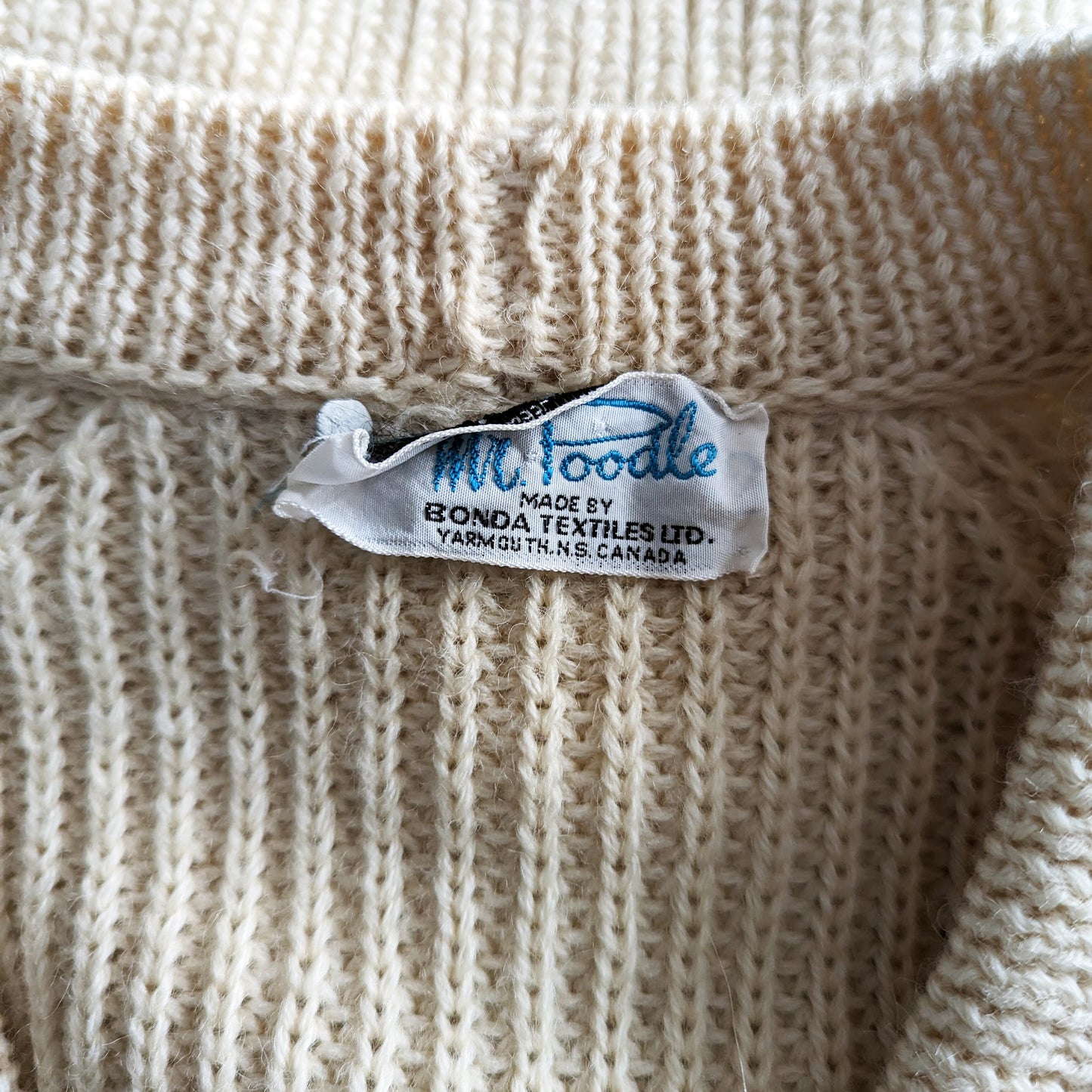 Close up of the Mr. Poodle tag