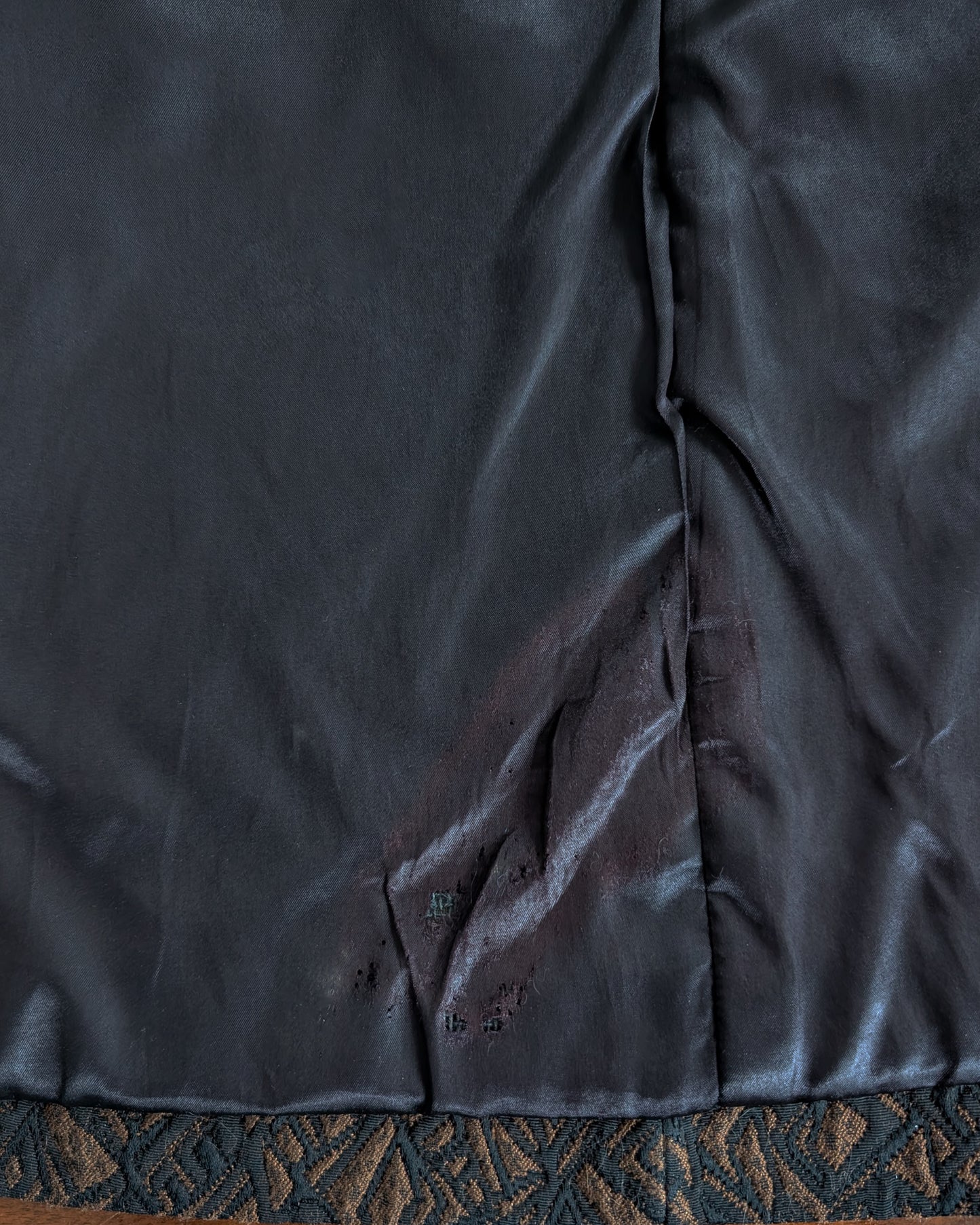 A close up that shows a flaw on the inside of the lining which looks like to be a burn of some sort