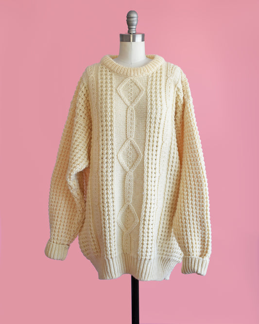 A vintage Irish cream wool with classic cable knit detail.