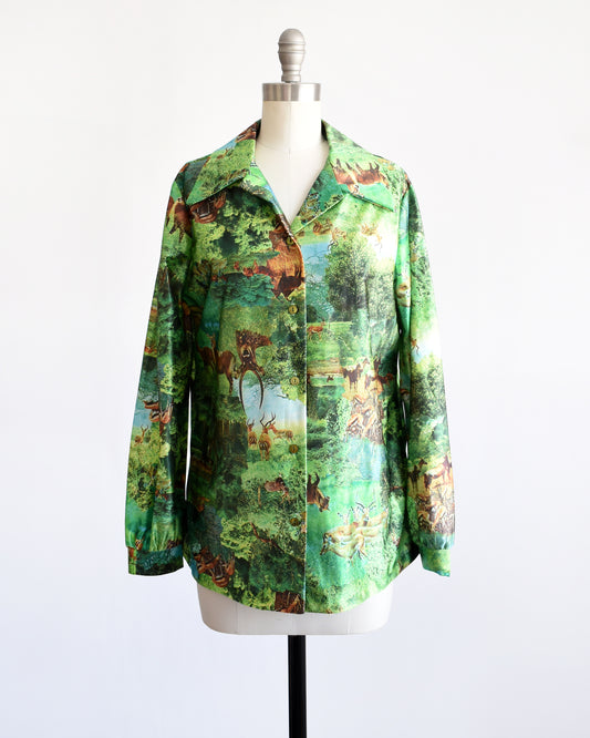 A vintage 70s green disco blouse that features a realistic photo print of different antelopes in different settings.