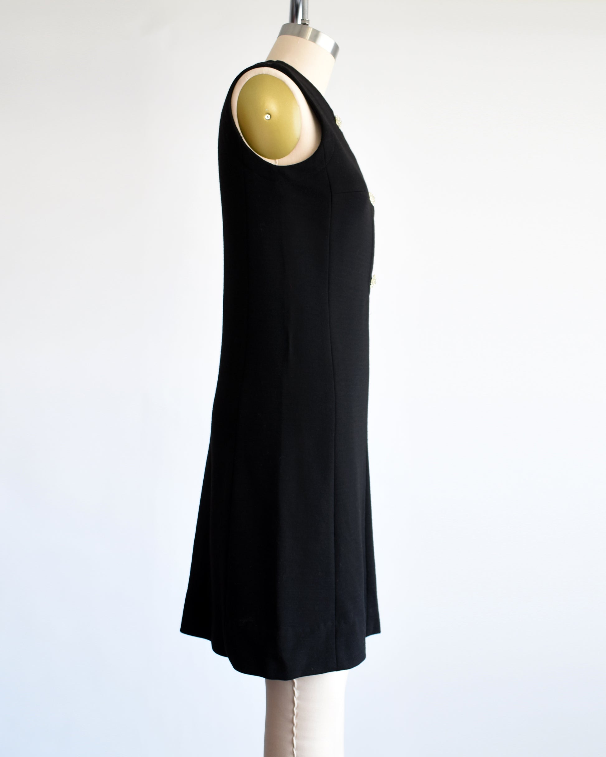 side view of  a vintage 1960s black keyhole rhinestone dress