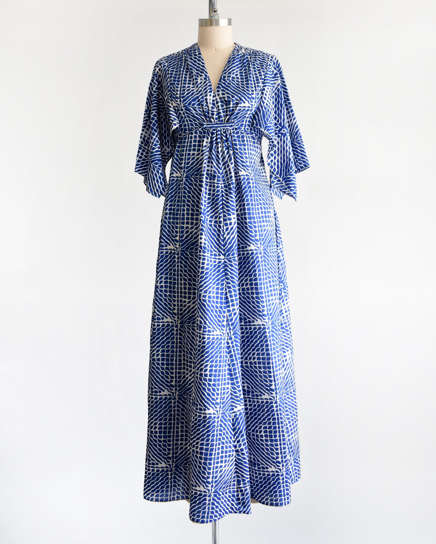 a vintage 1970s blue and white caftan with handkerchief sleeves