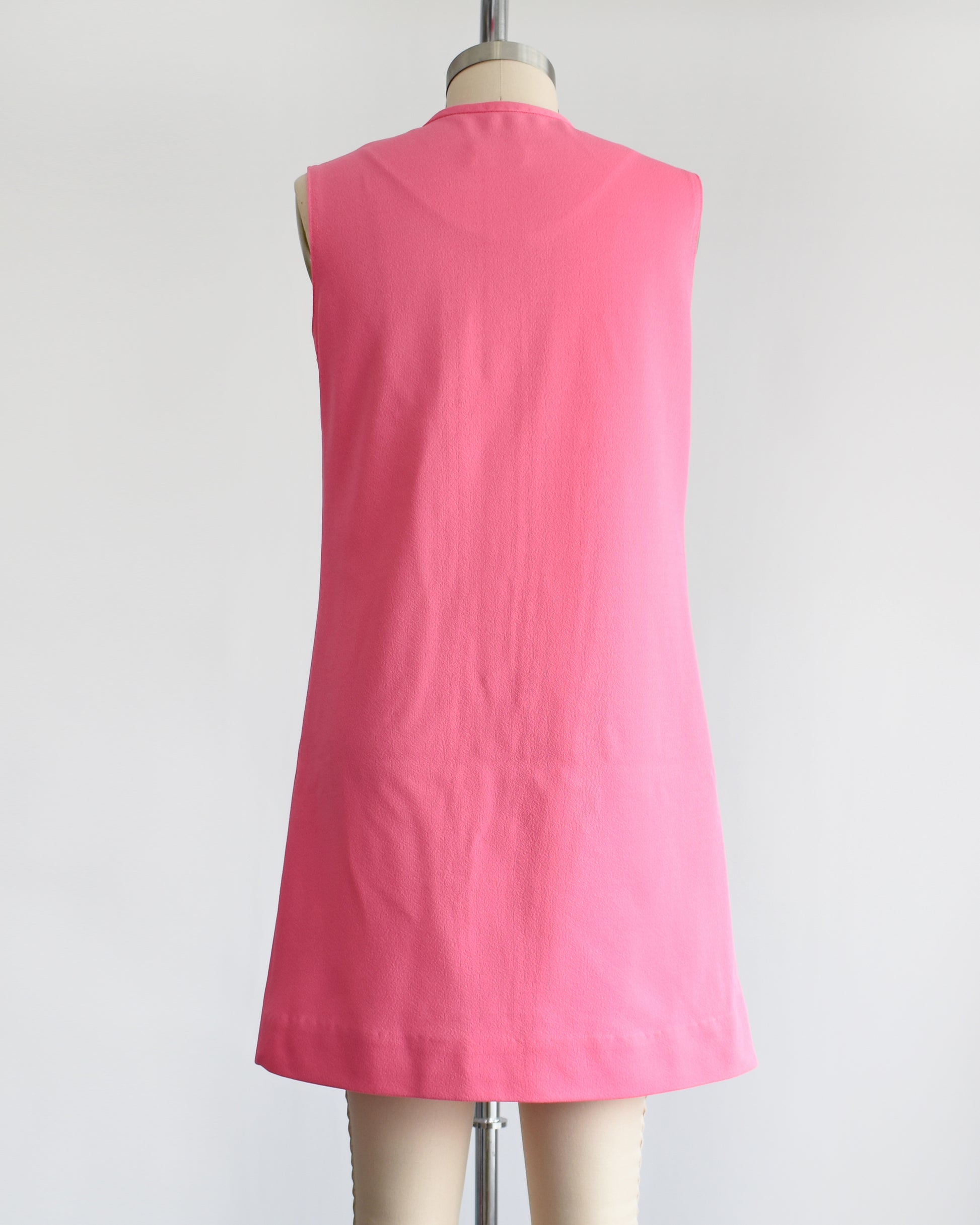 back view of a vintage 1960s pink mod mini dress