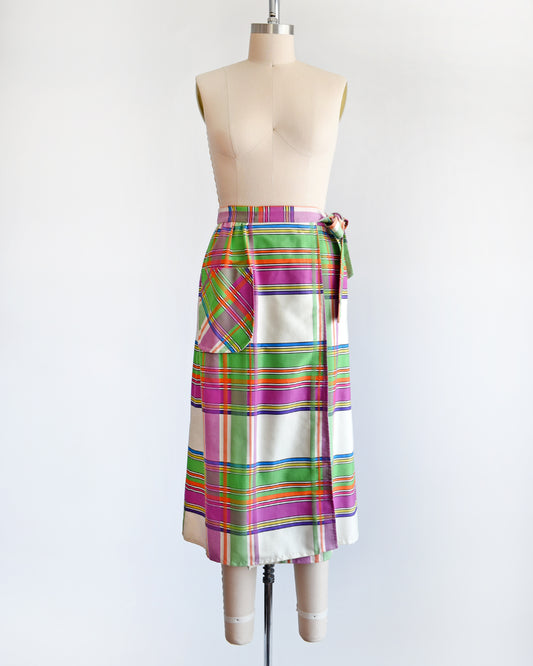A vintage 60s plaid wrap skirt with a patch pocket on the front.