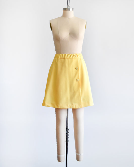 a vintage 1970s skort with three decorative buttons along the left side